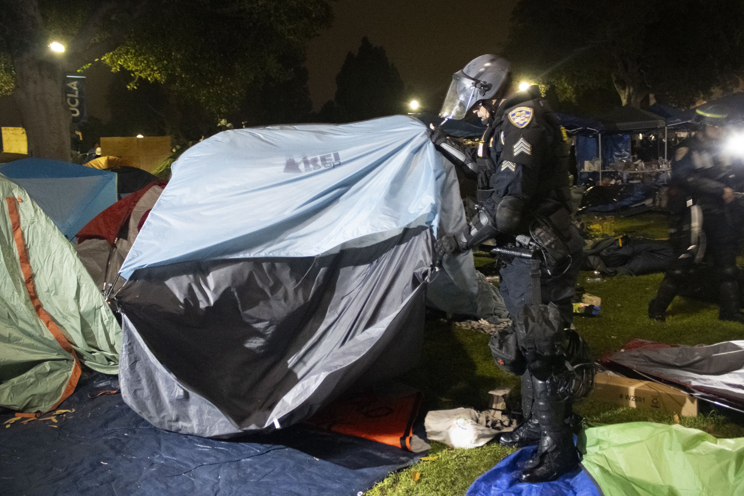  A California Highway Patrol (CHP) officer tears down tents in the encampment at University of California, Los Angeles supporting Gaza in the Israeli-Palestine Conflict on in Los Angeles, Calif., on Thursday, May 2, 2024. (Caylo Seals | The Corsair) 