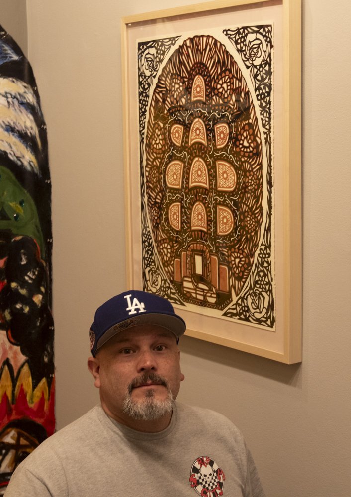  Ernie Lucero with his papel picado that is currently on view in the exhibition Arte Chicano Hecho En Los Angeles at the California Heritage Saturday April 6, 2024,  Museum in Santa Monica, Calif. (Laurel Rahn/ The Corsair) 