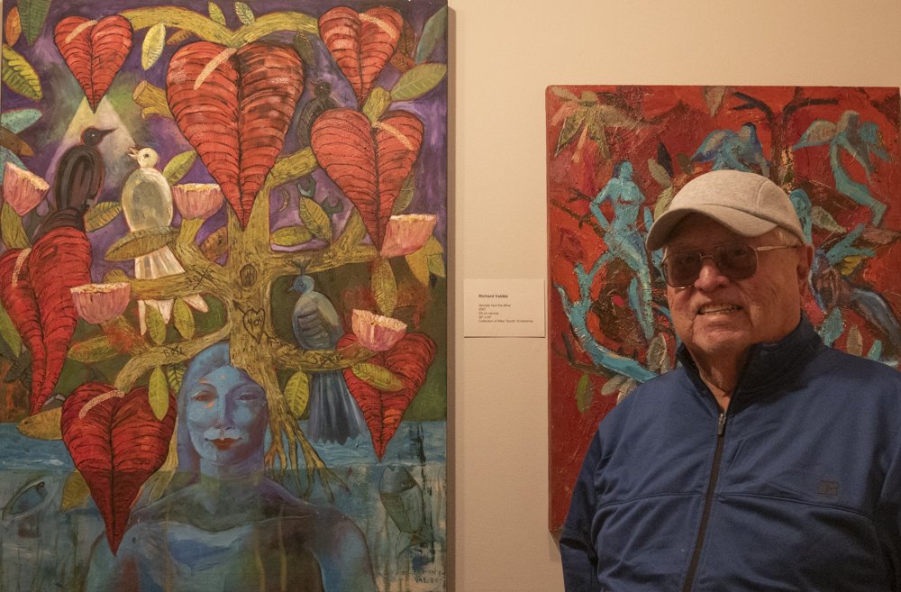  Richard Valdes with two of his paintings that are currently on view in the exhibition Arte Chicano Hecho En Los Angeles at the California Heritage Museum, Saturday April 6, 20204, Santa Monica, Calif. (Laurel Rahn/The Corsair) 