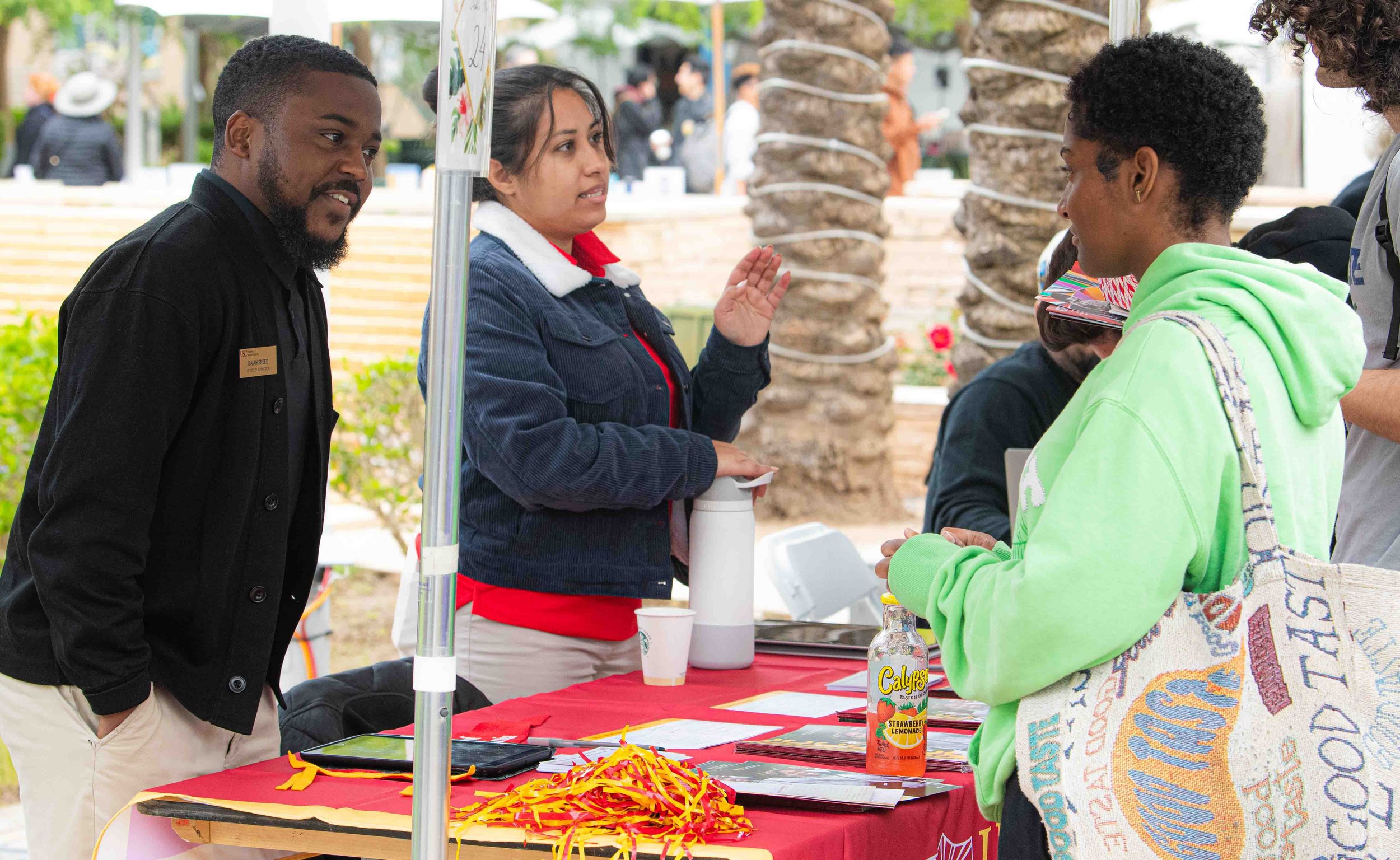  USC Officer of Admissions Isiah Sneed engages with a Santa Monica College student on behalf of admissions during the Santa Monica College fair on April 25,2024  in Santa Monica,Calif., (Corsair Photo:Jamael Shotomide) 