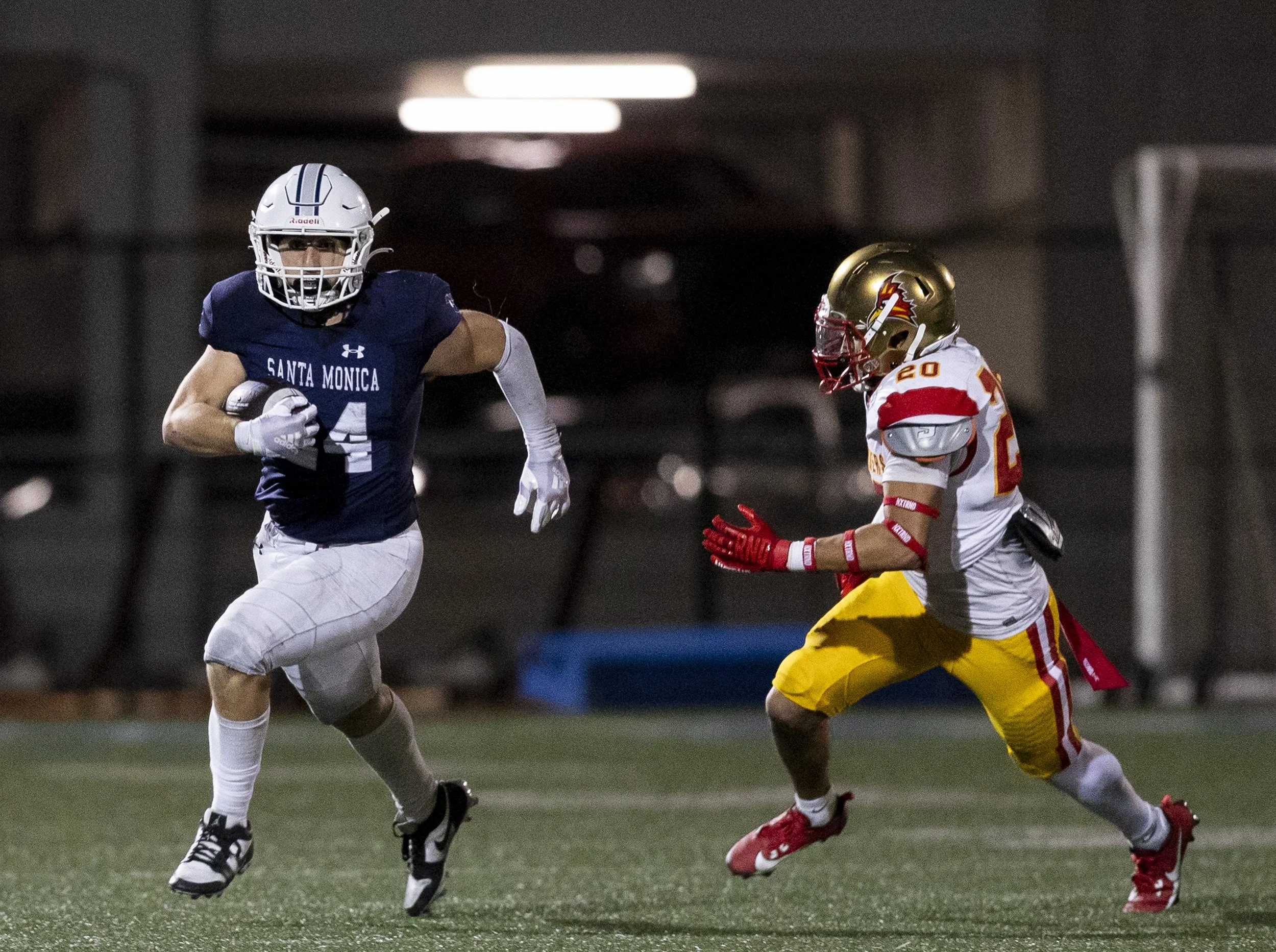  Santa Monica College's running back Pierce Reynoso (24) moves the ball as Desert’s linebacker Abel Flores (20) defends on Saturday, Sept. 14, 2024 at the Corsair Field in Santa Monica, Calif. Santa Monica College football defeated College of the Des