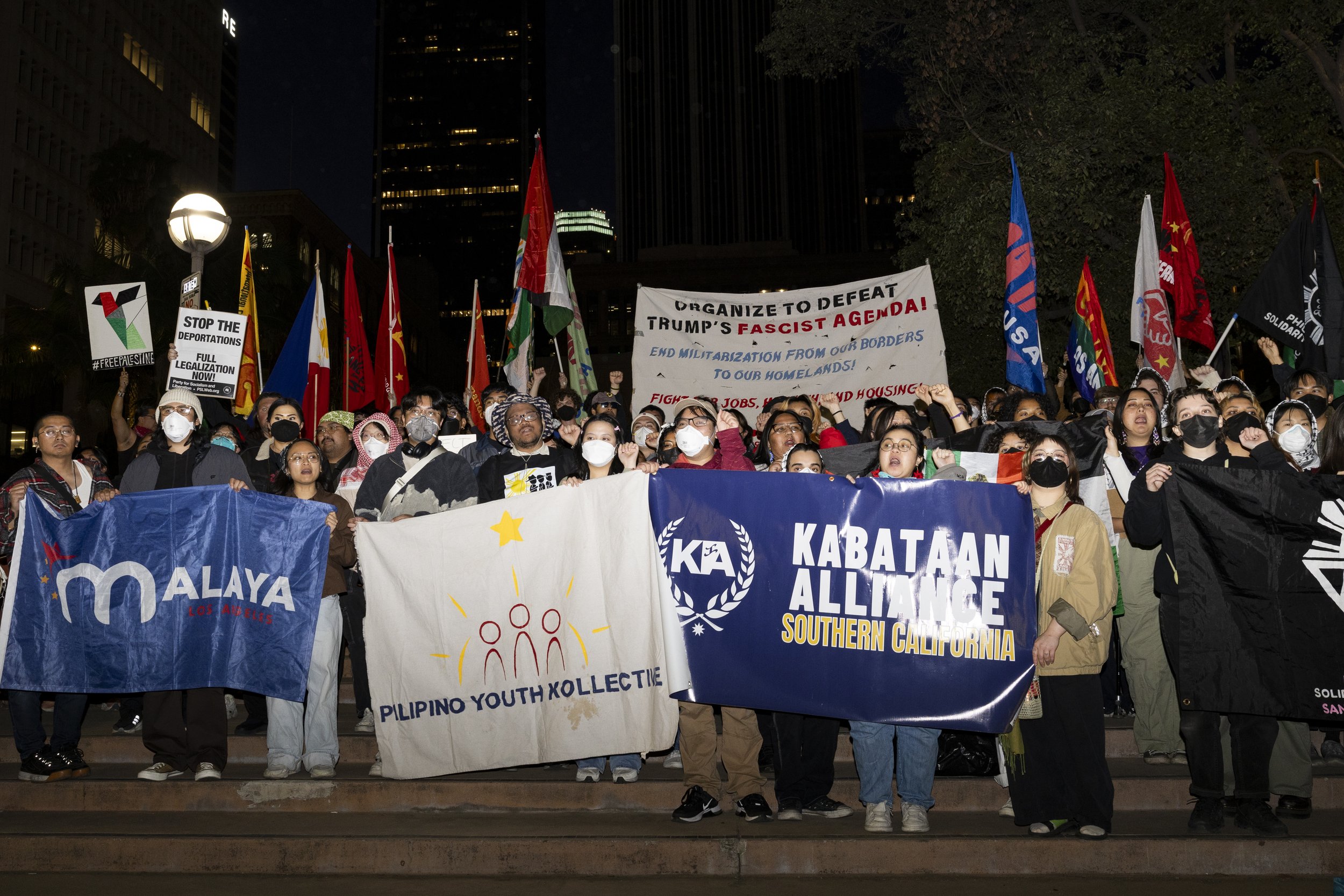 Protesters during the We Fight Back protest with the message of calling for the “defeat of Trump’s Extreme-Right Billionaire Agenda,” on Monday, January 20, 2025, on the steps of Pershing Square in downtown Los Angeles, Calif.(Jake Crandall | The Co