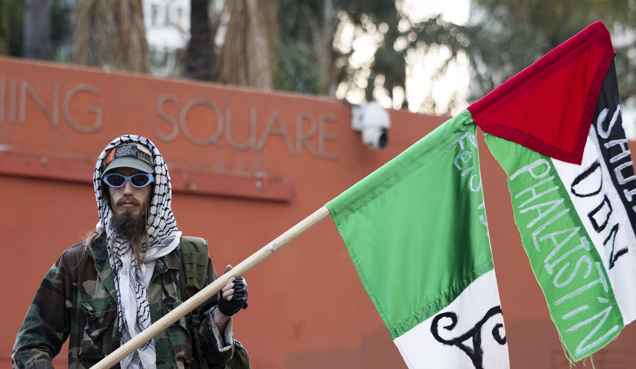 A protester holds a Palestinian flag up during the We Fight Back protest with the message of calling for the “defeat of Trump’s Extreme-Right Billionaire Agenda,” on Monday, January 20, 2025, at Pershing Square in downtown Los Angeles, Calif. (Jake