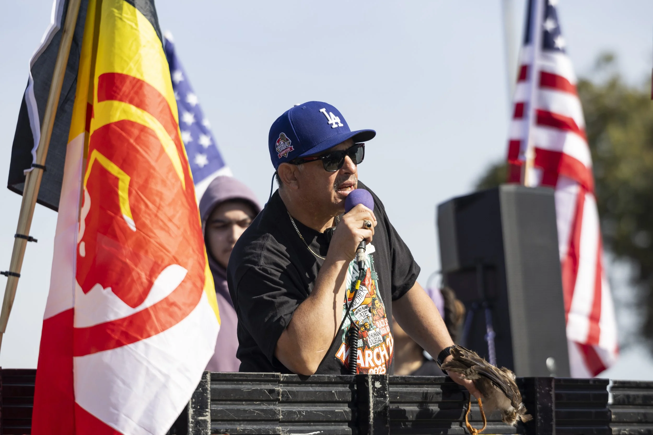 Manuel Lares, an organizer with Homies Unidos speaks at the March for Humanity to protest new Trump administration policies and gather support for immigrant rights and social justice issues at John Adams Middle School in Santa Monica, Calif., on Sat