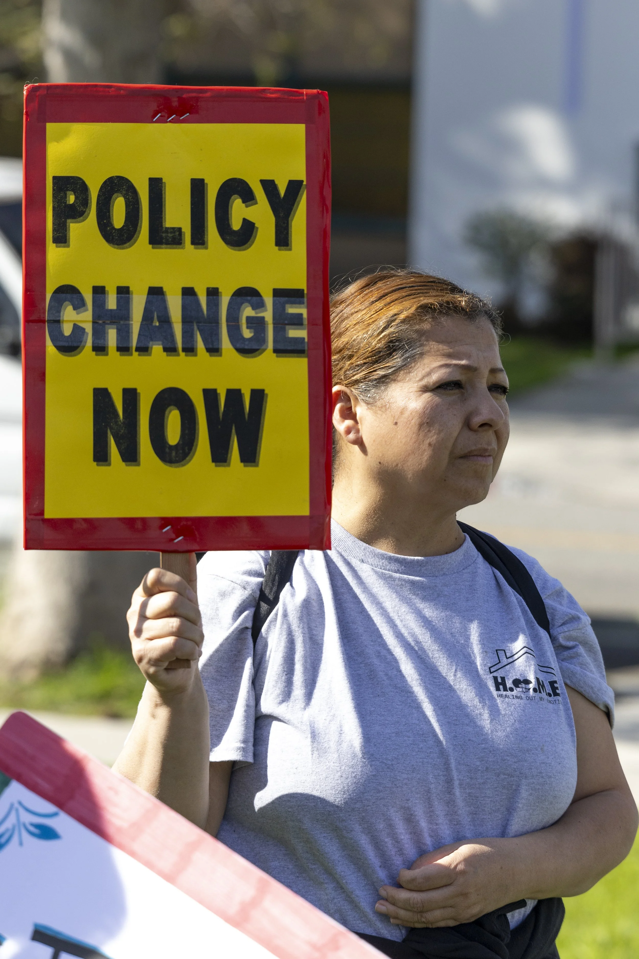 A protester holds up a sign at the March for Humanity to protest new Trump administration policies and gather support for immigrant rights and social justice issues at John Adams Middle School in Santa Monica, Calif., on Saturday, March 22, 2025.(Ja