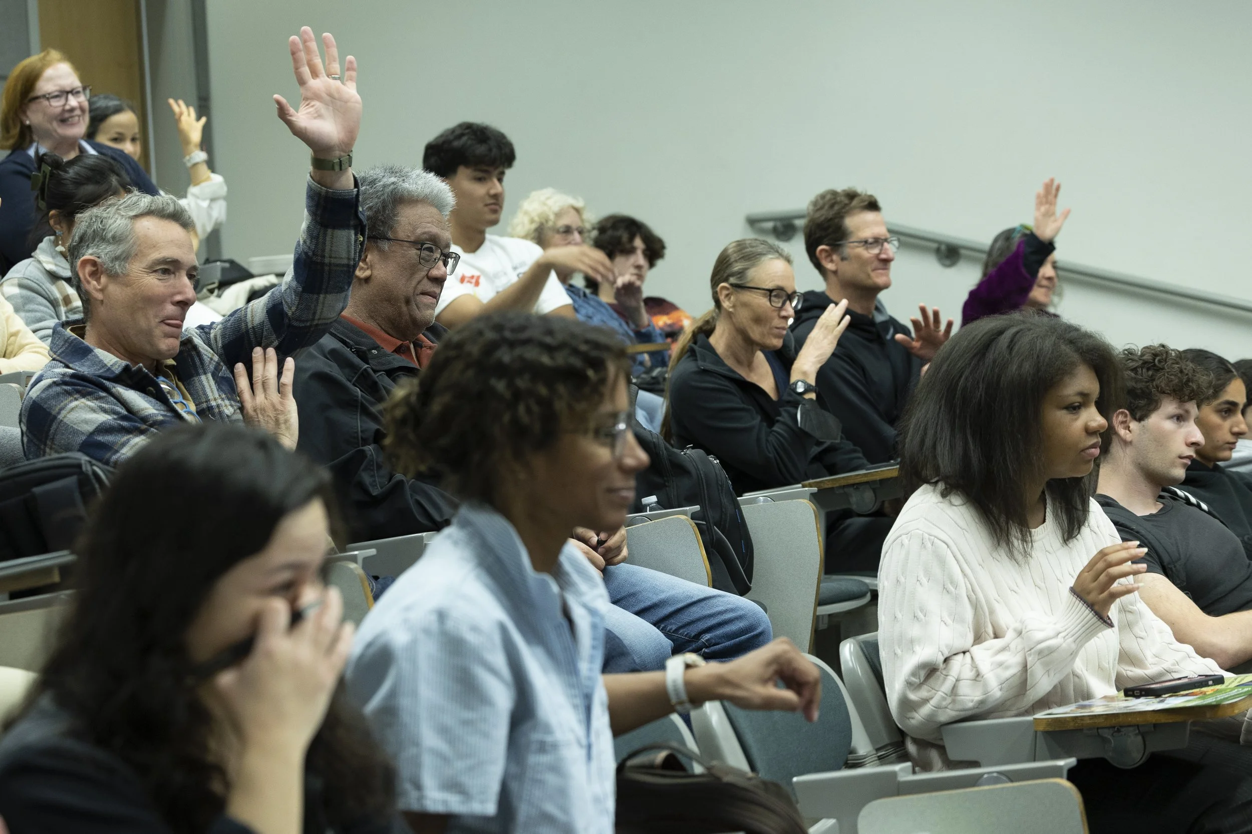  Audience, including Santa Monica College (SMC) students, alumni and faculty show hands in response to a question by William Selby, a retired SMC geography professor and author of his latest book ‘The California’s Sky Watcher: Understanding Weather P