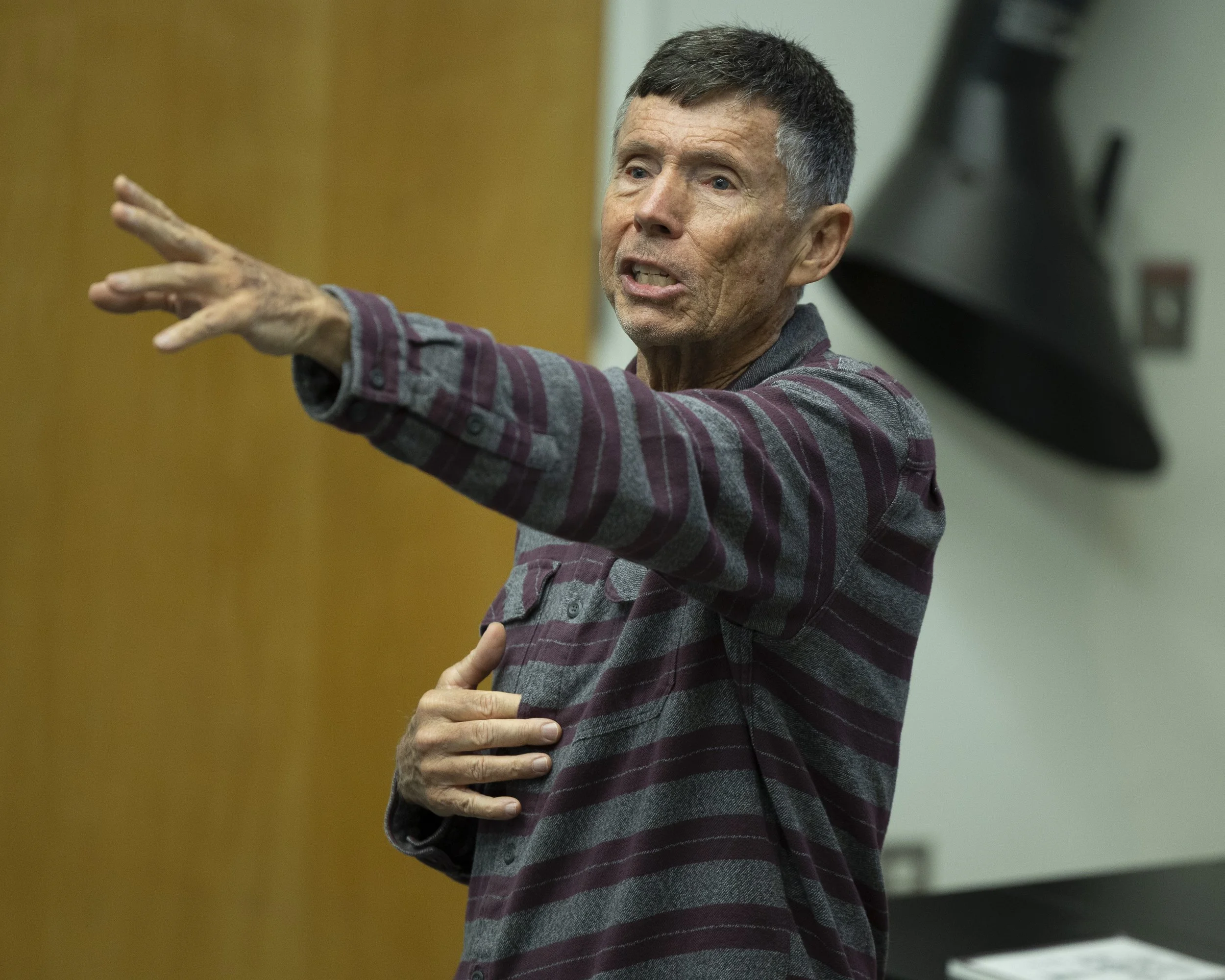  William Selby, a 71-year-old, retired Santa Monica College (SMC) geography professor and author of his latest book ‘The California’s Sky Watcher: Understanding Weather Patterns and What Comes Next’, gestures during his presentation as a featured spe