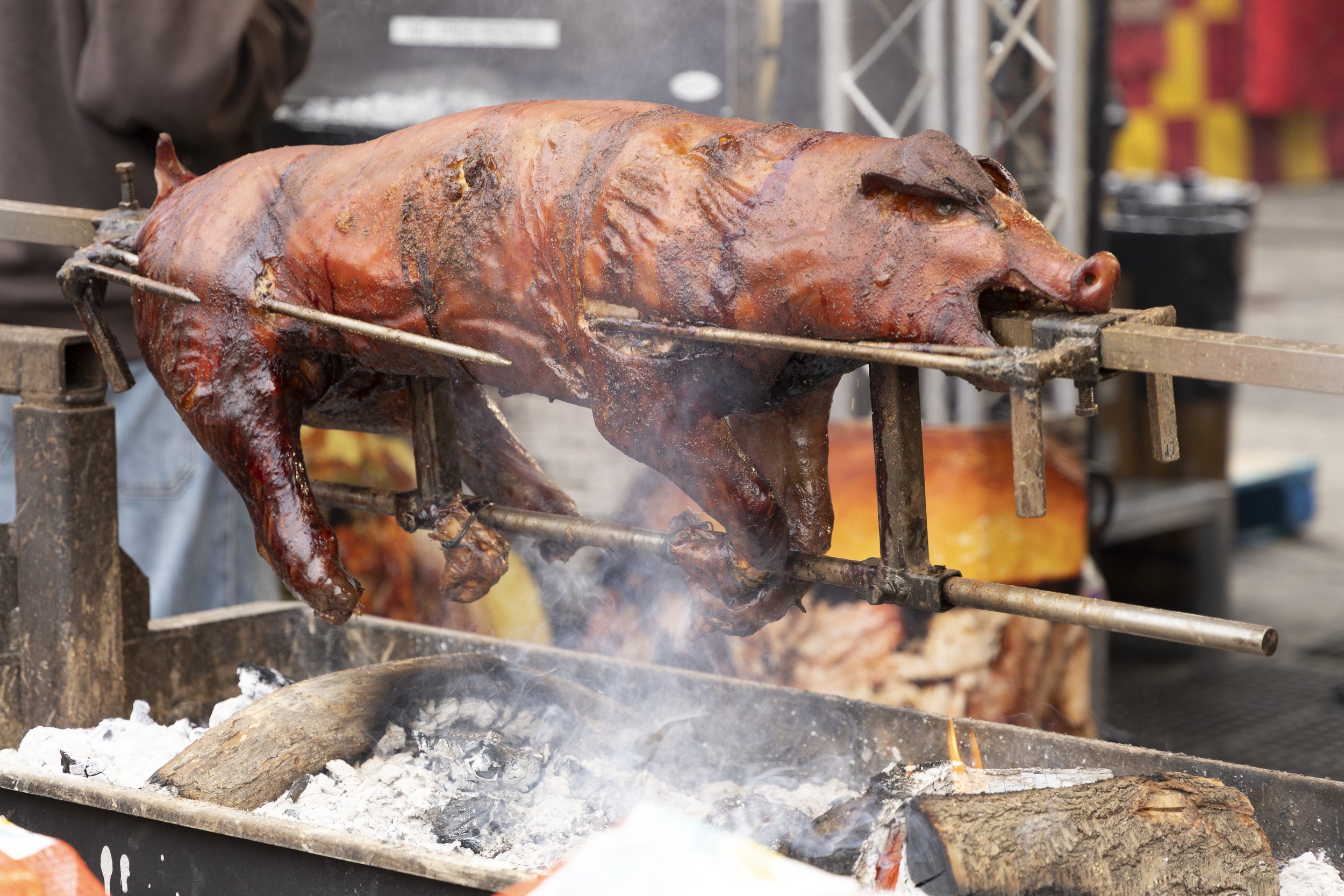  A pig roasts over the fire at the Los Angeles County Fair at Fairplex in Pomona, Calif., on Sunday, May 4, 2025. (Silke Eichholz | The Corsair) 