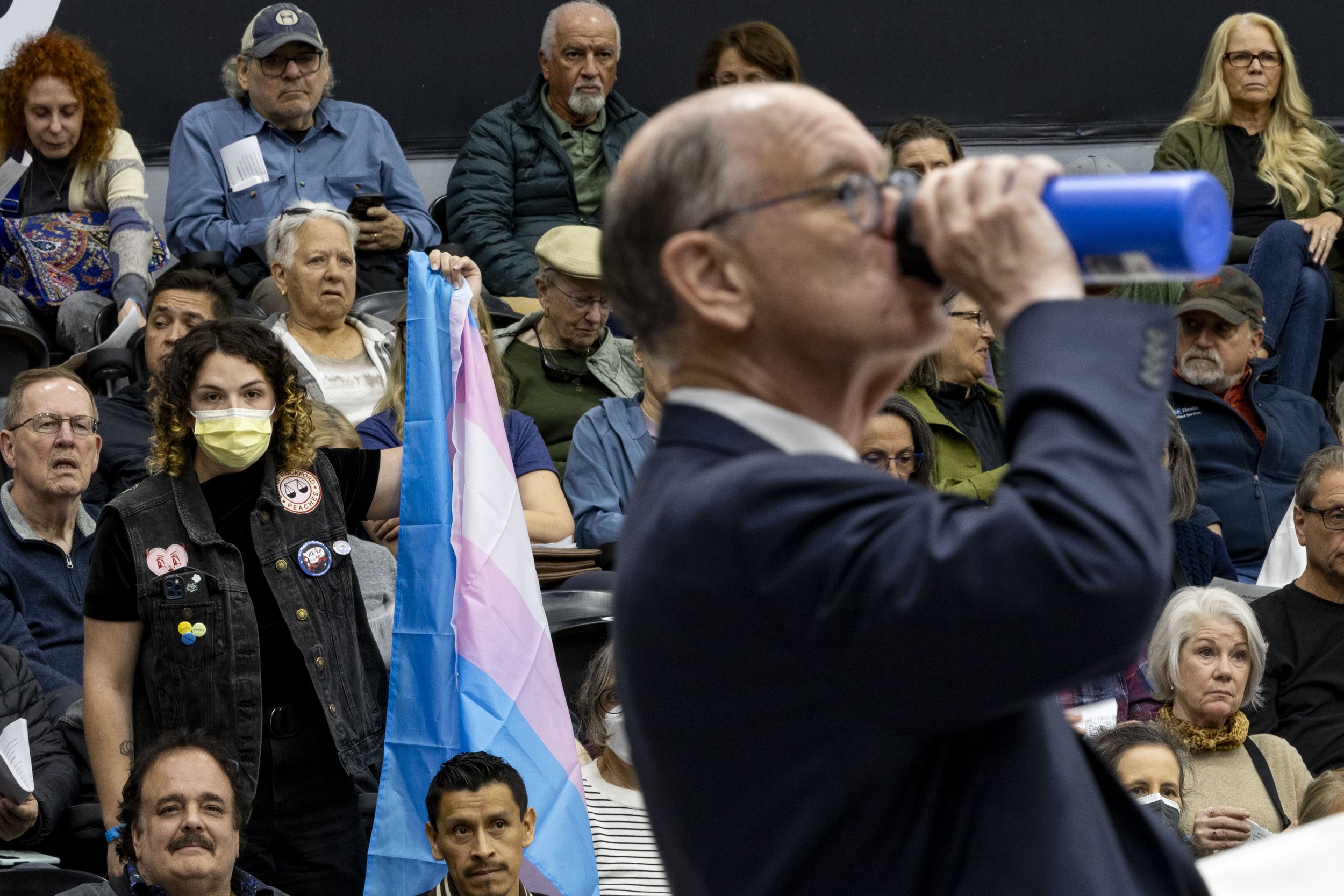Flora Gonska, a trans rights supporter, clutches a transgender pride flag, and asks House Rep. Brad Sherman from California’s 32nd congressional district during his Town Hall, “Do you support trans rights?” at California State University, Northridge