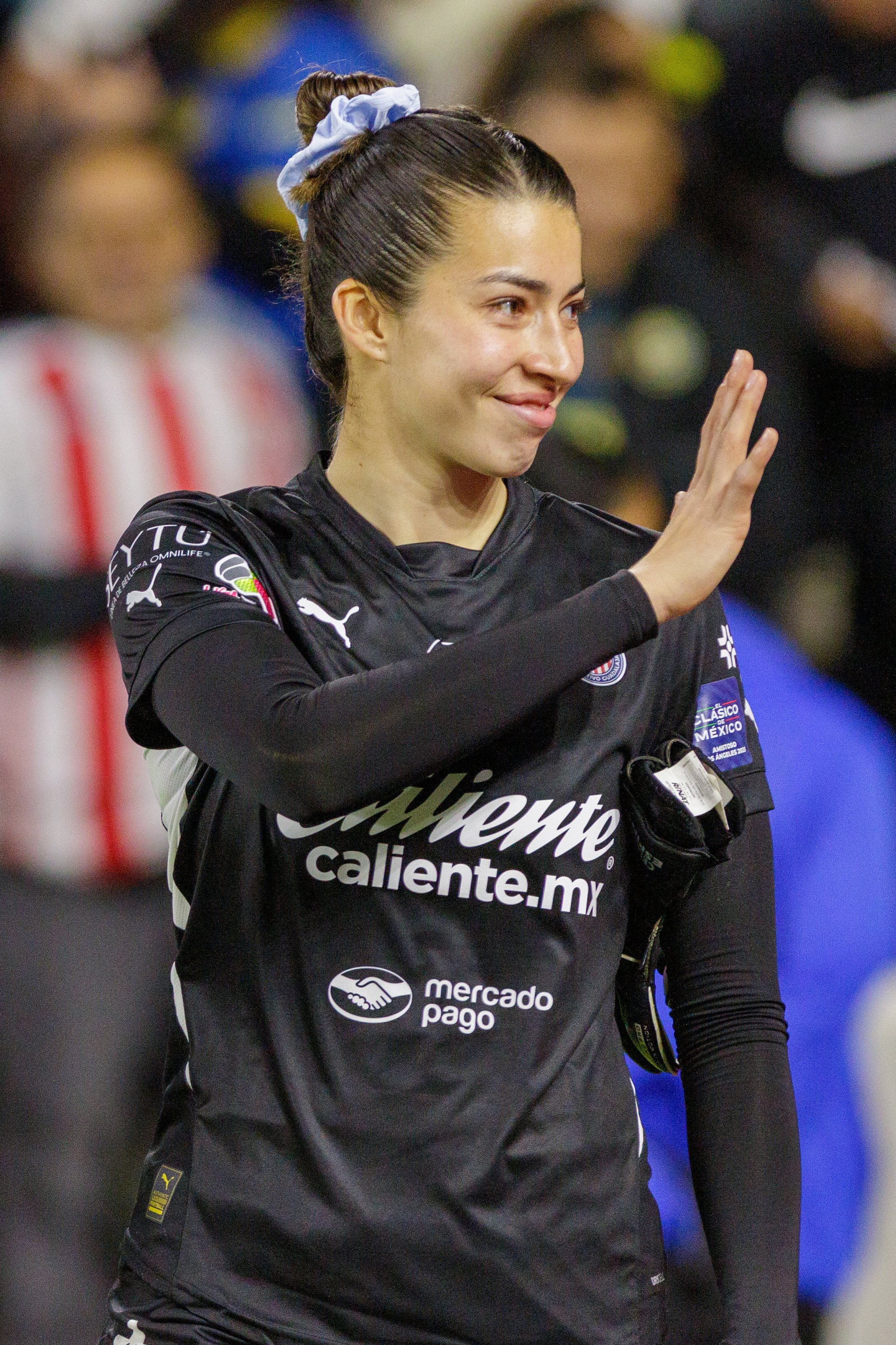 Celeste Epino, goalkeeper for Chivas de Guadalajara, waves to soccer fans after the game on Saturday May 17, 2025 at Bank of Montreal (BMO) Stadium, Los Angeles, Calif. This is the first “El Clásico Femenil : Club América vs. Chivas de Guadalajara,”