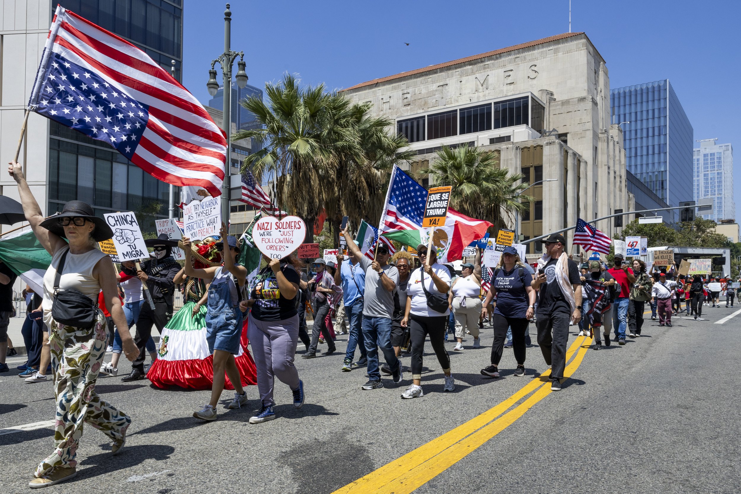 Protesters march in downtown Los Angeles, Calif., on Friday, July 4, 2025. 50501 SOCAL organized a protest called End The Occupation, criticizing the Trump administration’s passing of the Big Beautiful Bill and calling for a stop to the ongoing ICE