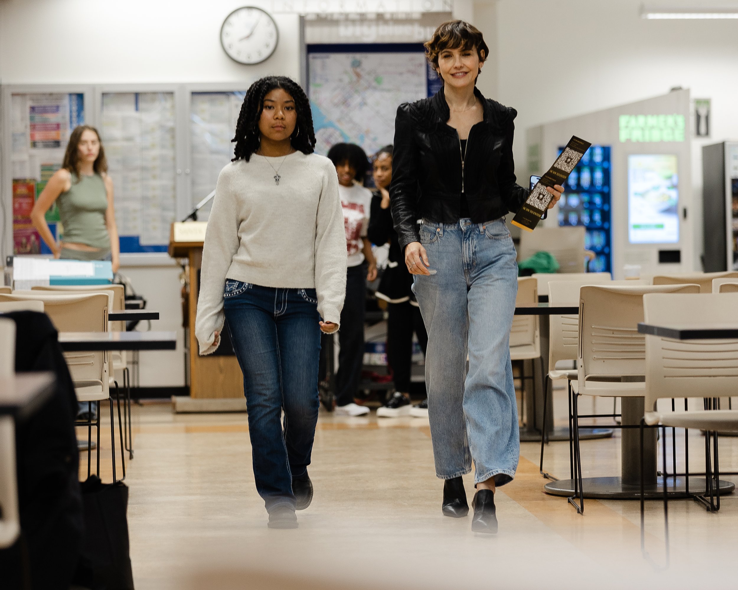 Professional model Gabriela Oltean (right), rehearses how to walk the runway with a model for the upcoming LaMode fashion show on Thursday, May 29, 2025 in the Cayton Center at Santa Monica College, Santa Monica, Calif. (Mary Funsten | The Corsair)