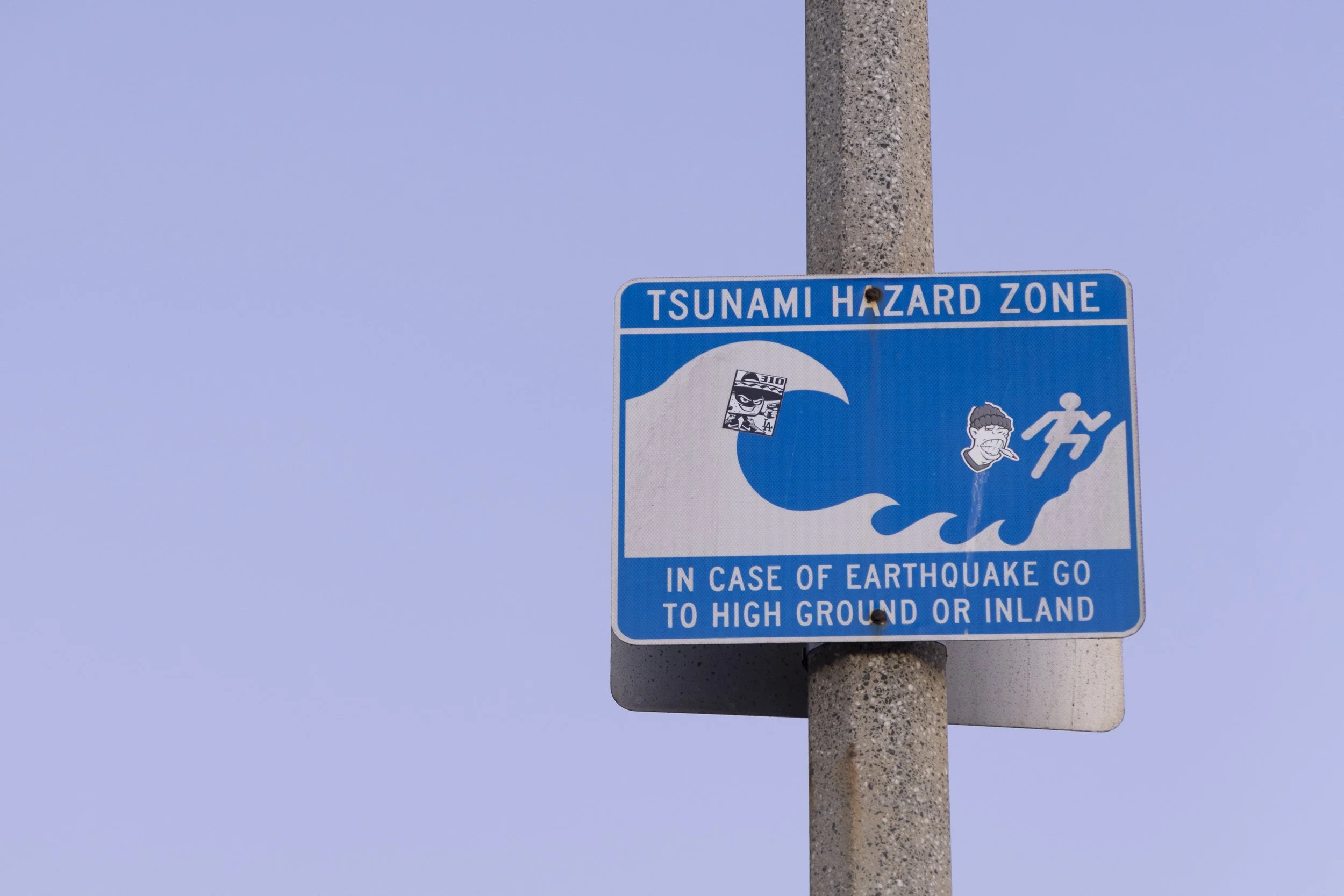  A Tsunami Hazard Zone sign shows the way to higher grounds at Beach Parking Lot 4 South at Hollister Avenue in Santa Monica, Calif., on Tuesday, July 29, 2025. A Tsunami advisory was issued for the California coast after a massive Russian earthquake