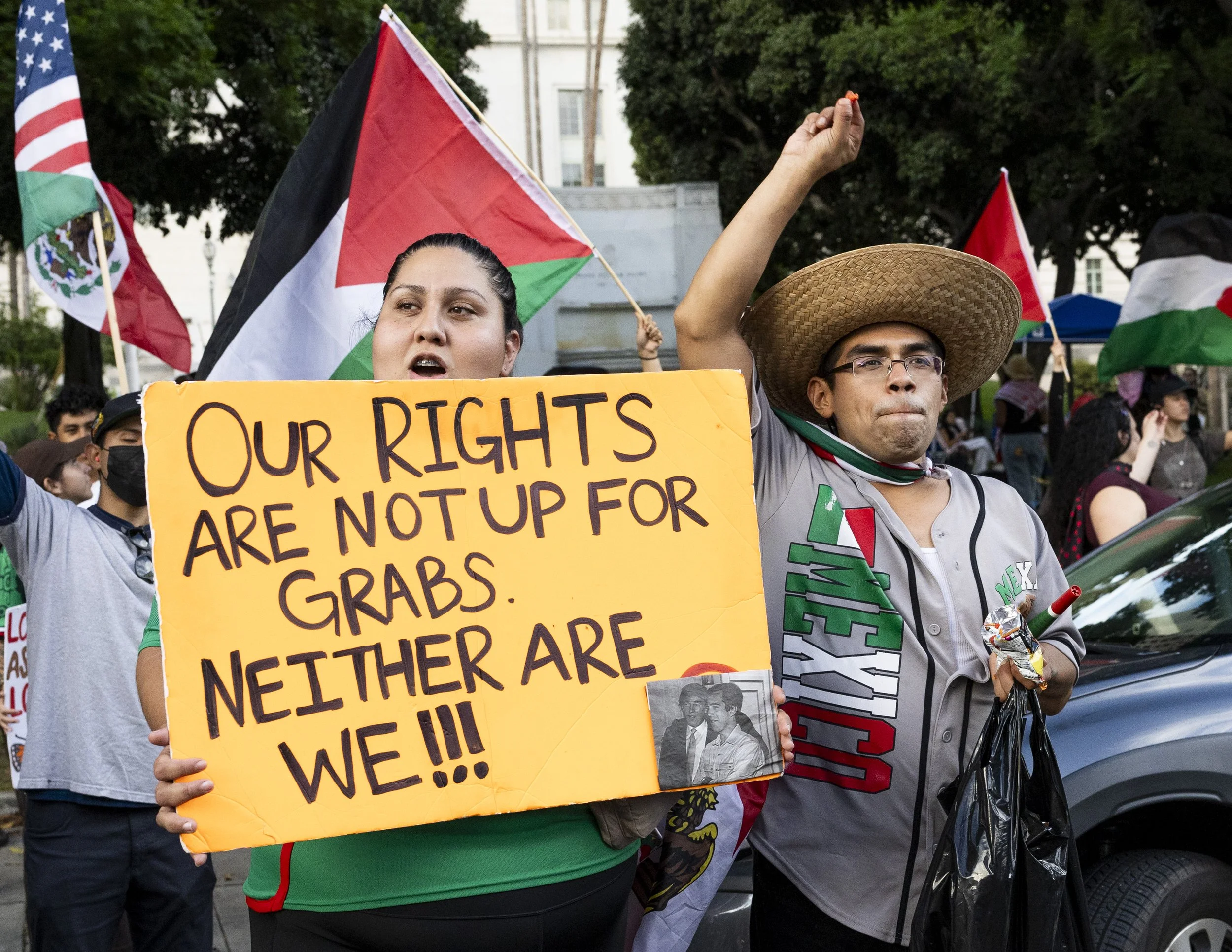 Protesters waved anti-ICE signs on West First Street on the side of City Hall in Los Angeles, Calif., on Monday, Sept. 1, 2025, to protest increased immigration enforcement. (Kayjel J. Mairena | The Corsair)