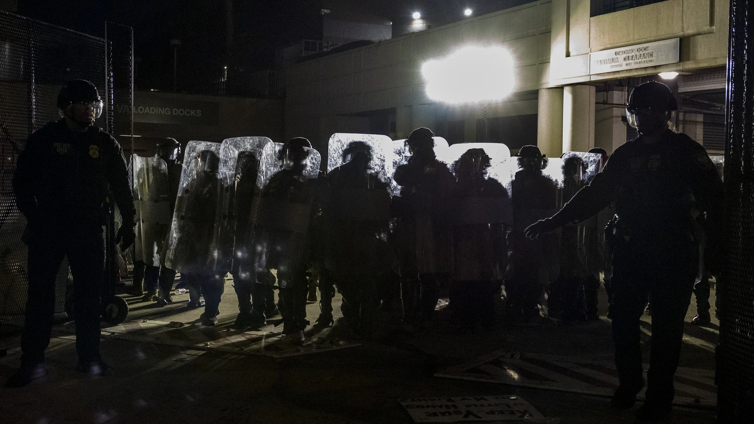 DHS agents post a line of California National Guardsmen at the gate outside of the Metropolitan Detention Center in Los Angeles, Calif., on Monday, Sept. 1, 2025, during an anti-ICE protest. (Kayjel J. Mairena | The Corsair)