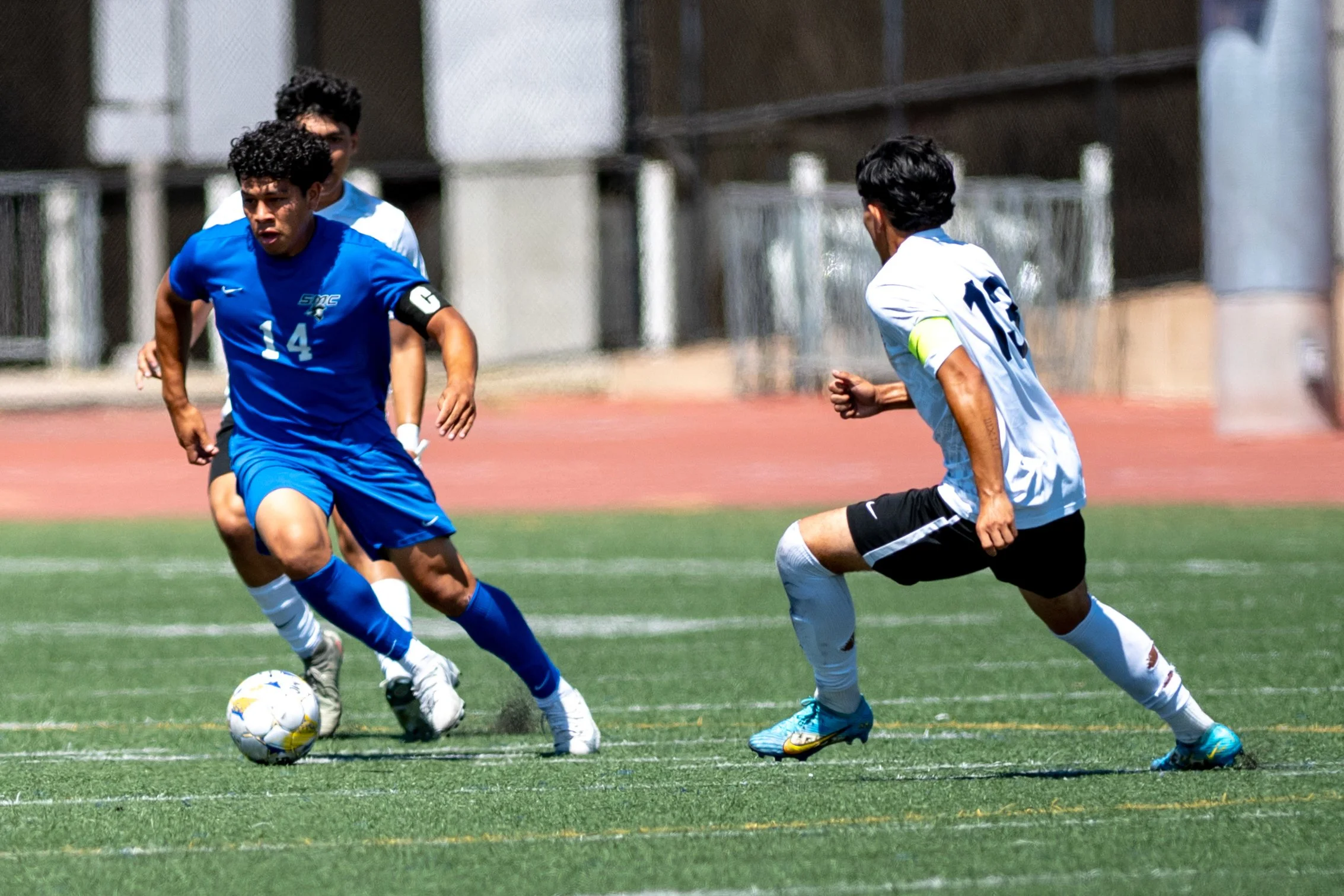 Santa Monica College (SMC) Corsair defender (14) Maeva Dubuque splitting two Fullerton College Hornets on Tuesday, September 9, 2025, in Santa Monica,Calif. The Corsairs tide with the Hornets 4-4.(Tom Rosholt | The Corsair)