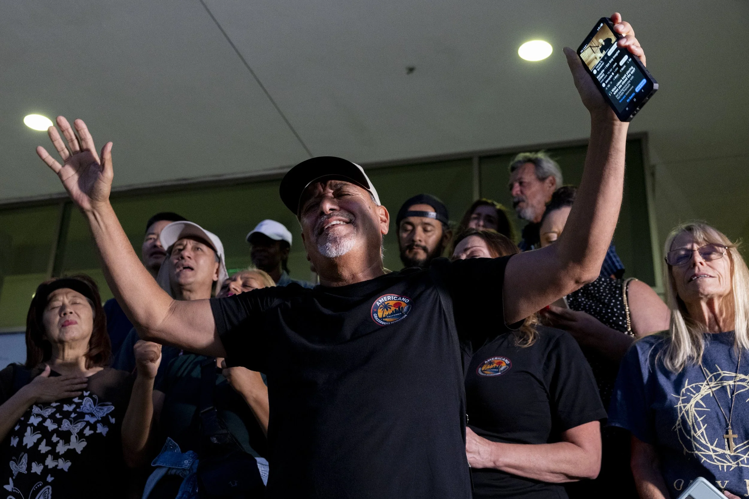 Benito Bernal, who had helped Charlie Kirk set up the first Turning Point USA in Los Angeles, led mourners in a prayer who gathered after Charlie Kirk’s assassination at a vigil held outside the Federal building in downtown Los Angeles on Thursday,