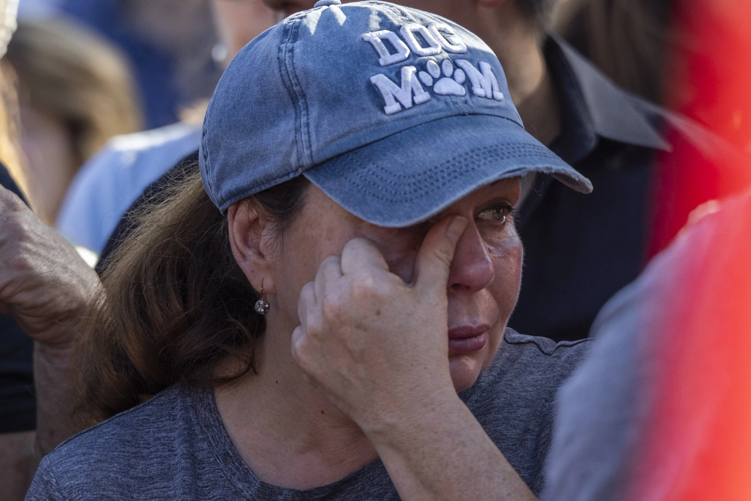 A mourner wipes tears from her eye at a vigil held in Beverly Hills, Calif., on Sunday, Sept 14, 2025, after Charlie Kirk’s assassination.(Jake Crandall | The Corsair)