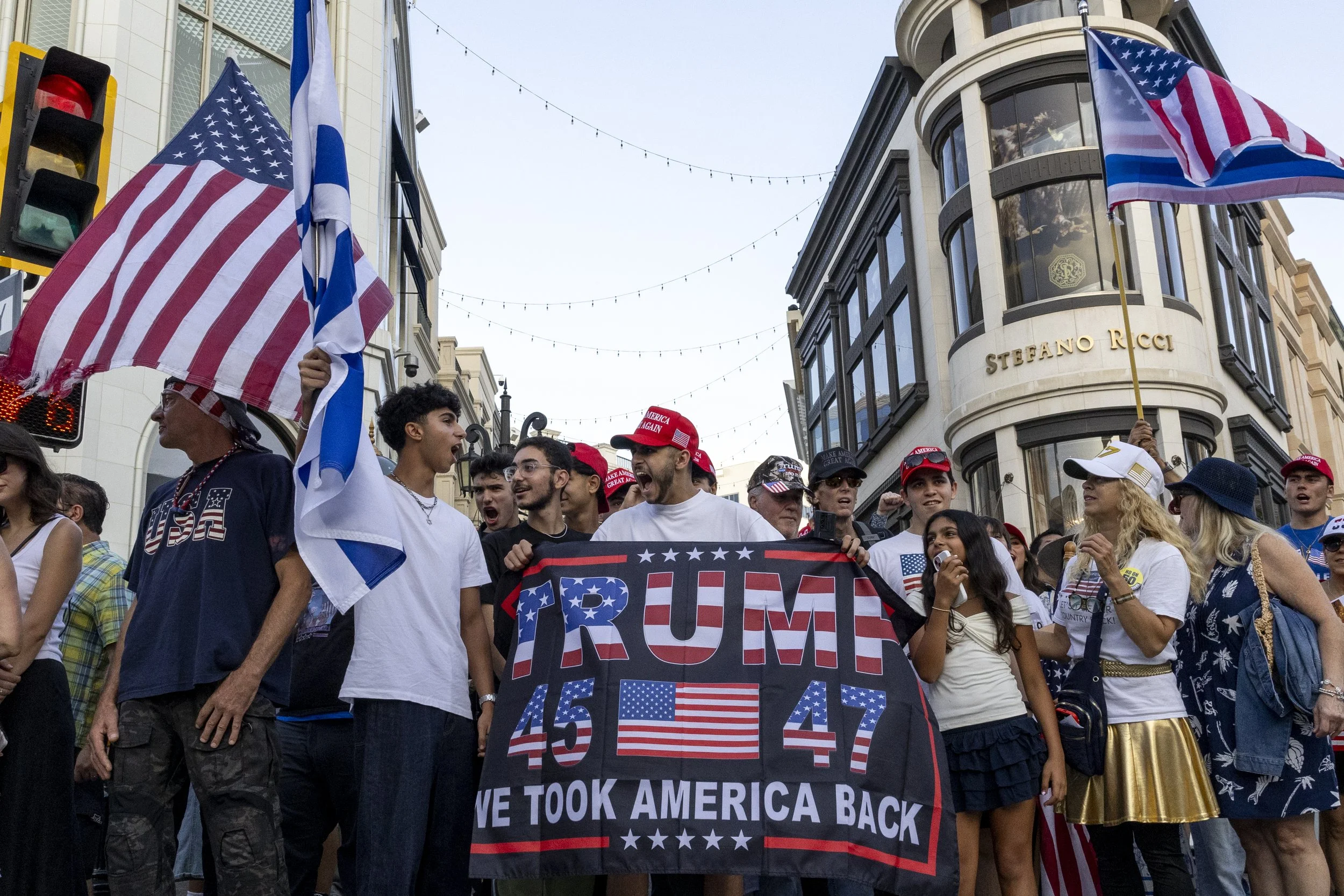 Attendees of a Charlie Kirk vigil march through the streets of Beverly Hills, Calif., on Sunday, Sept 14, 2025.(Jake Crandall | The Corsair)