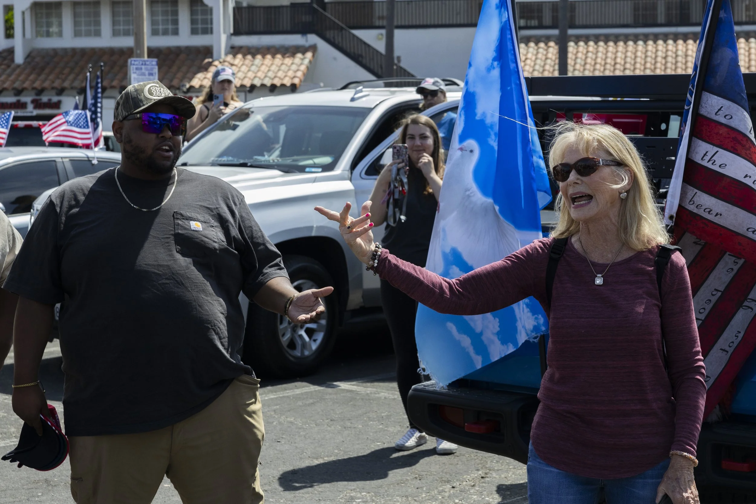 A woman argues with members of 805 Patriots, a pro-Maga group, for their beliefs about Charlie Kirk at Point Hueneme, Calif., on Saturday, Sept. 13, 2025, after a remembrance cruise dedicated to the victims of 9/11 and Charlie Kirk. The woman had ca