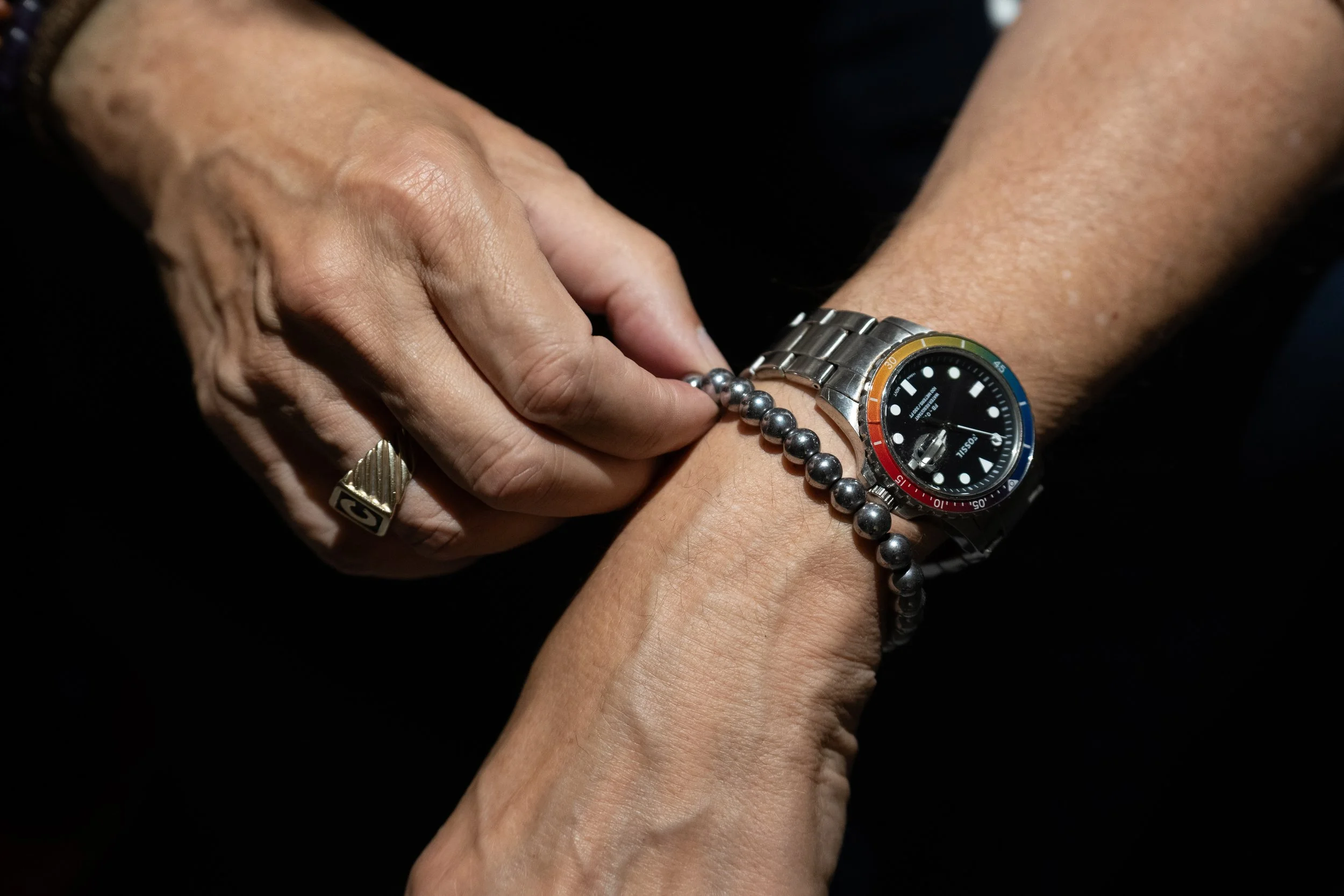 Alan Chapman, radio host, music lecturer, educator and composer, adjusts a bracelet during an interview before guest hosting Orchestra Santa Monica’s “Classical Jukebox” concert at BroadStage on September 7, 2025 in Santa Monica, Calif. The bracelet