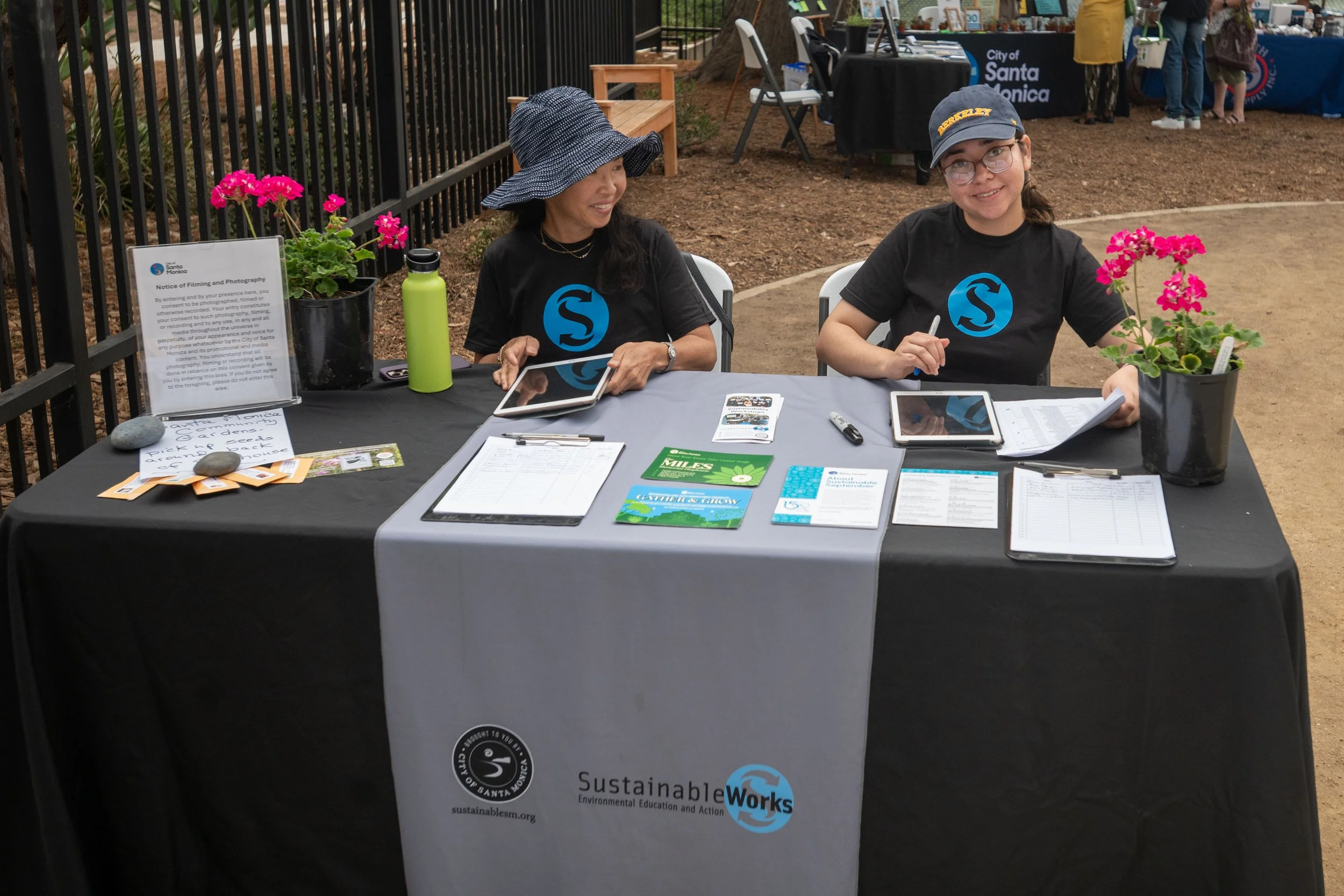 (L to R) Miki Yoshimoto and Brisa Alvarez, Santa Monica College student coordinator, manning sign-in booth at the Sustainability Landscape Expo at Miles Playhouse Christine Emerson Reed park on Saturday, September 13, 2025, Santa Monica,Calif. (Tom