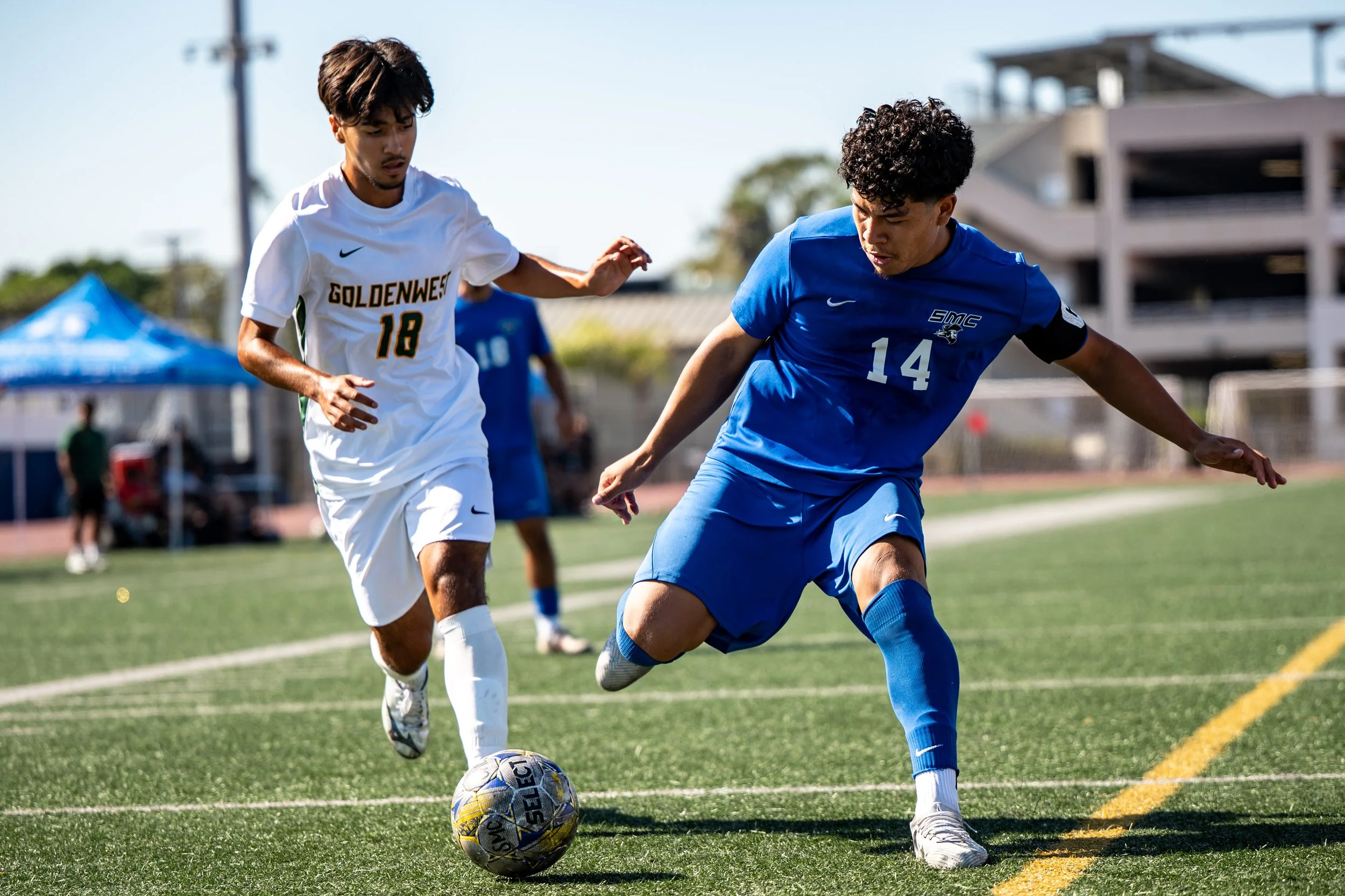 Santa Monica College (SMC) Corsair forward (14) Jefferson Parada dribbling passed Golden West Rustlers midfielder, (18) Rocky Trejo on Tuesday, September 16, 2025, Santa Monica,Calif. The Corsairs won 4-1. (Tom Rosholt | The Corsair)