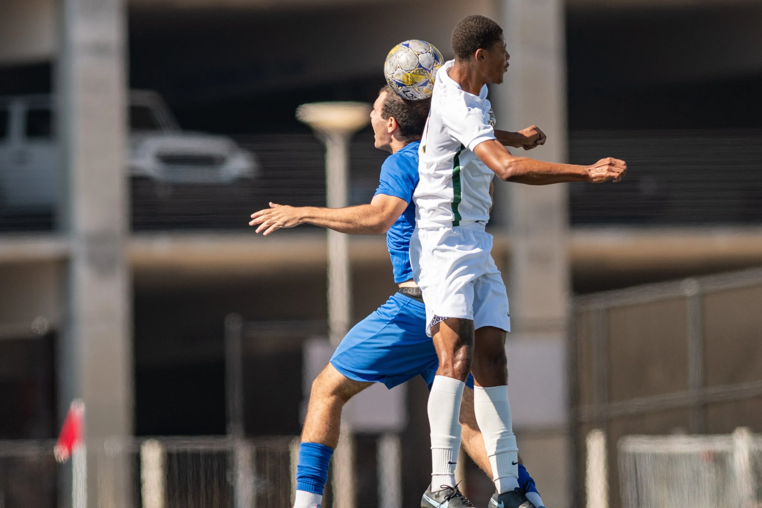 Santa Monica College (SMC) Corsair forward (11) Danny Spindler header against Golden West Rustlers defender on Tuesday, September 16, 2025, Santa Monica,Calif. The Corsairs won 4-1. (Tom Rosholt | The Corsair)