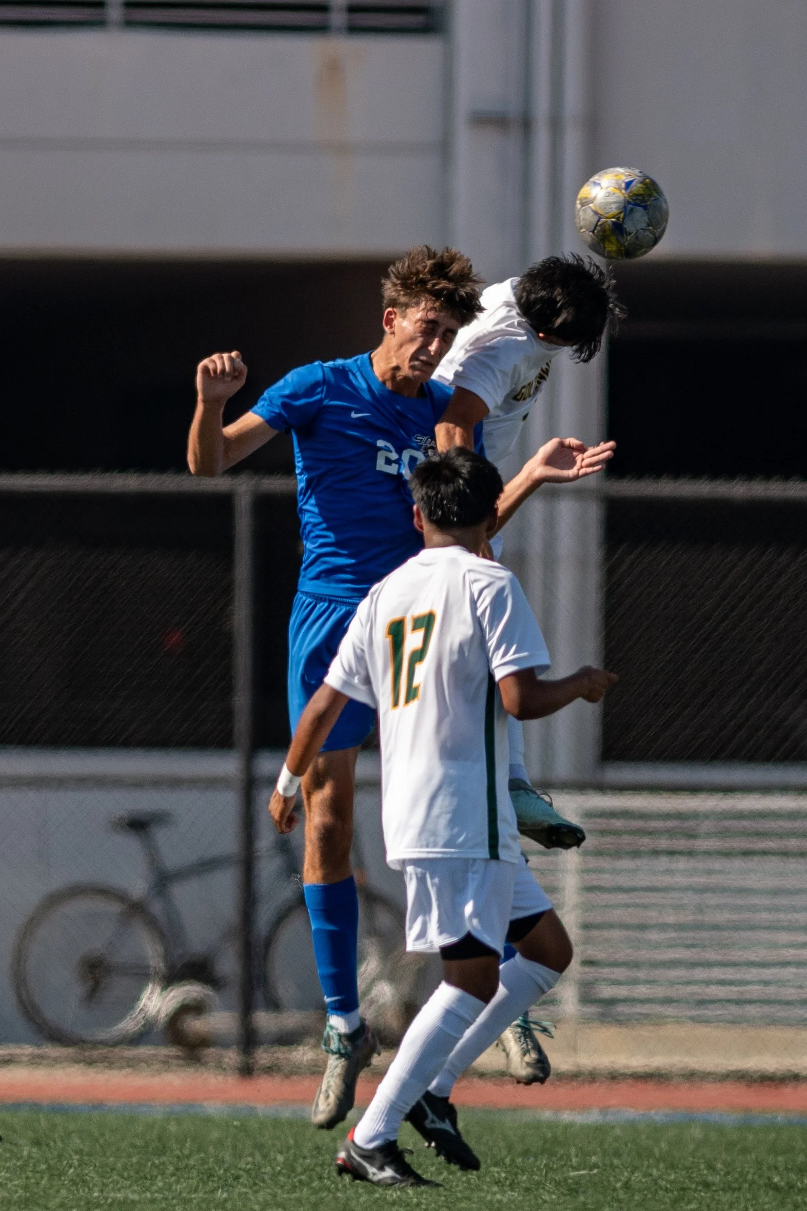 Santa Monica College (SMC) Corsair midfielder (20) Leo Blanchet header between 2 Golden West Rustlers defenders on Tuesday, September 16, 2025, Santa Monica,Calif. The Corsairs won 4-1. (Tom Rosholt | The Corsair)