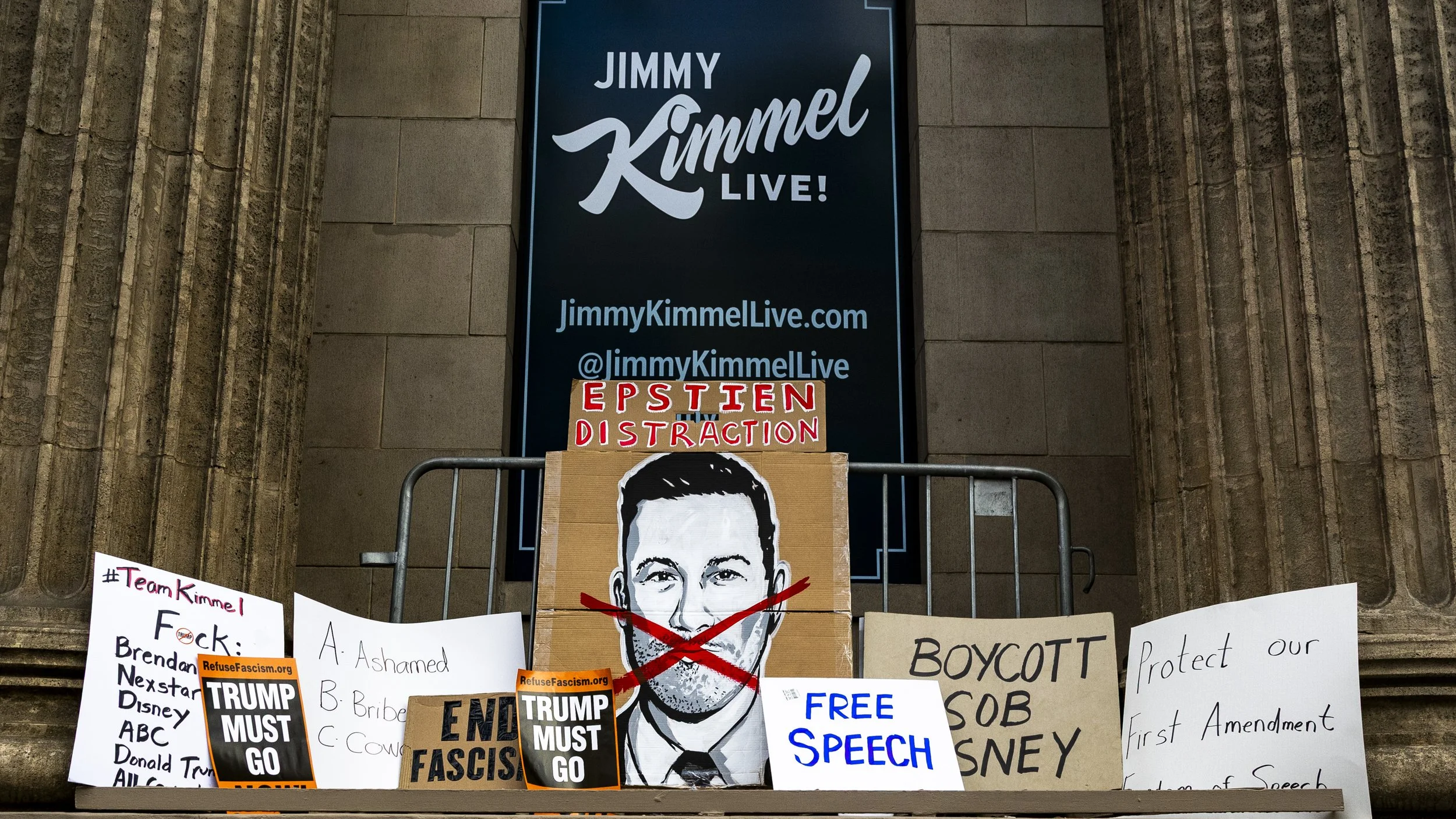 Protesters placed signs outside El Capitan Entertainment Centre in Hollywood, Calif., on Thursday, Sept. 18, to protest the cancellation of Jimmy Kimmel’s late-night talk show, “Jimmy Kimmel Live,” after ABC indefinitely suspended the show following