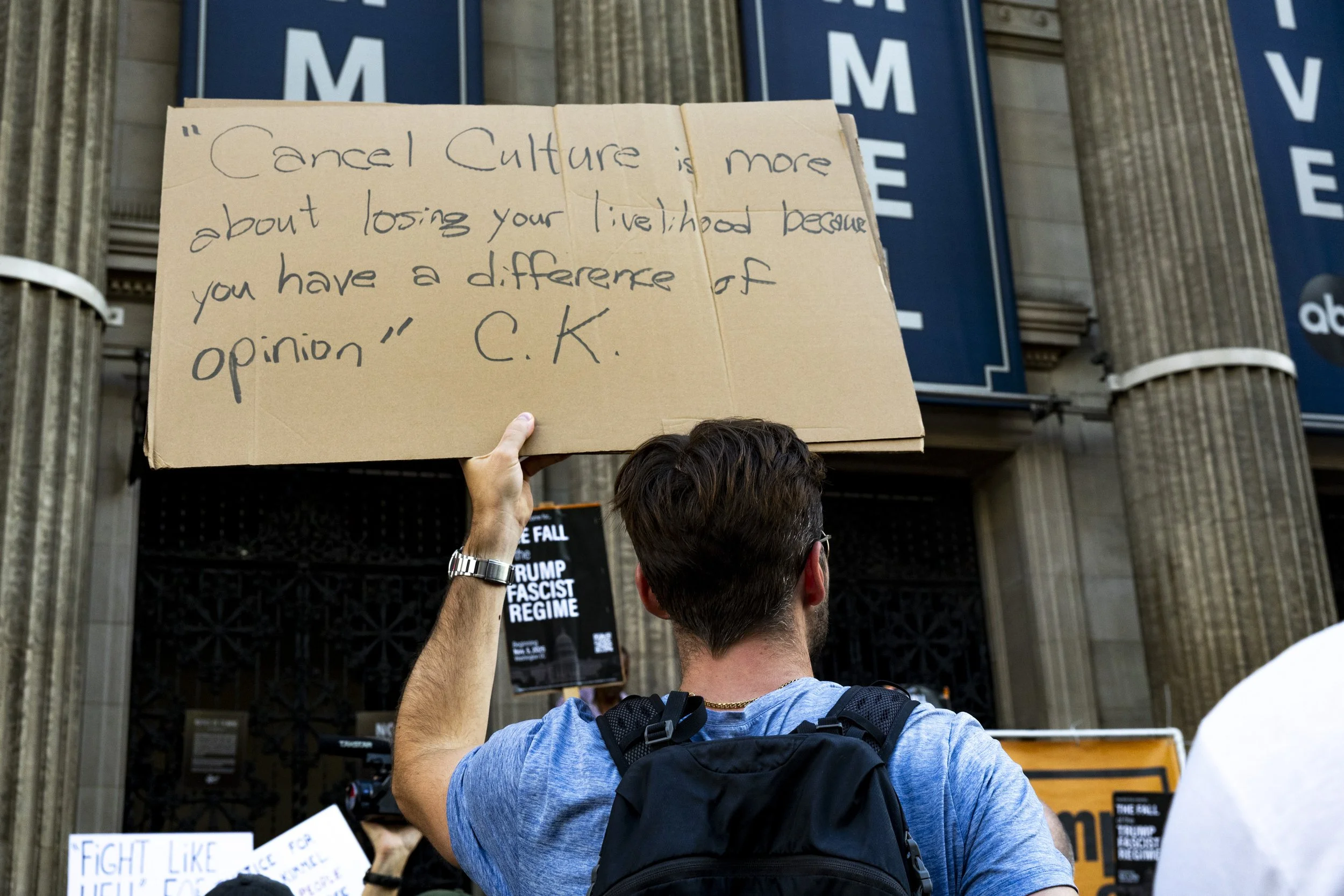 A protester held a sign outside El Capitan Entertainment Centre in Hollywood, Calif., on Thursday, Sept. 18, to protest the cancellation of Jimmy Kimmel’s late-night talk show, “Jimmy Kimmel Live,” after ABC indefinitely suspended the show following