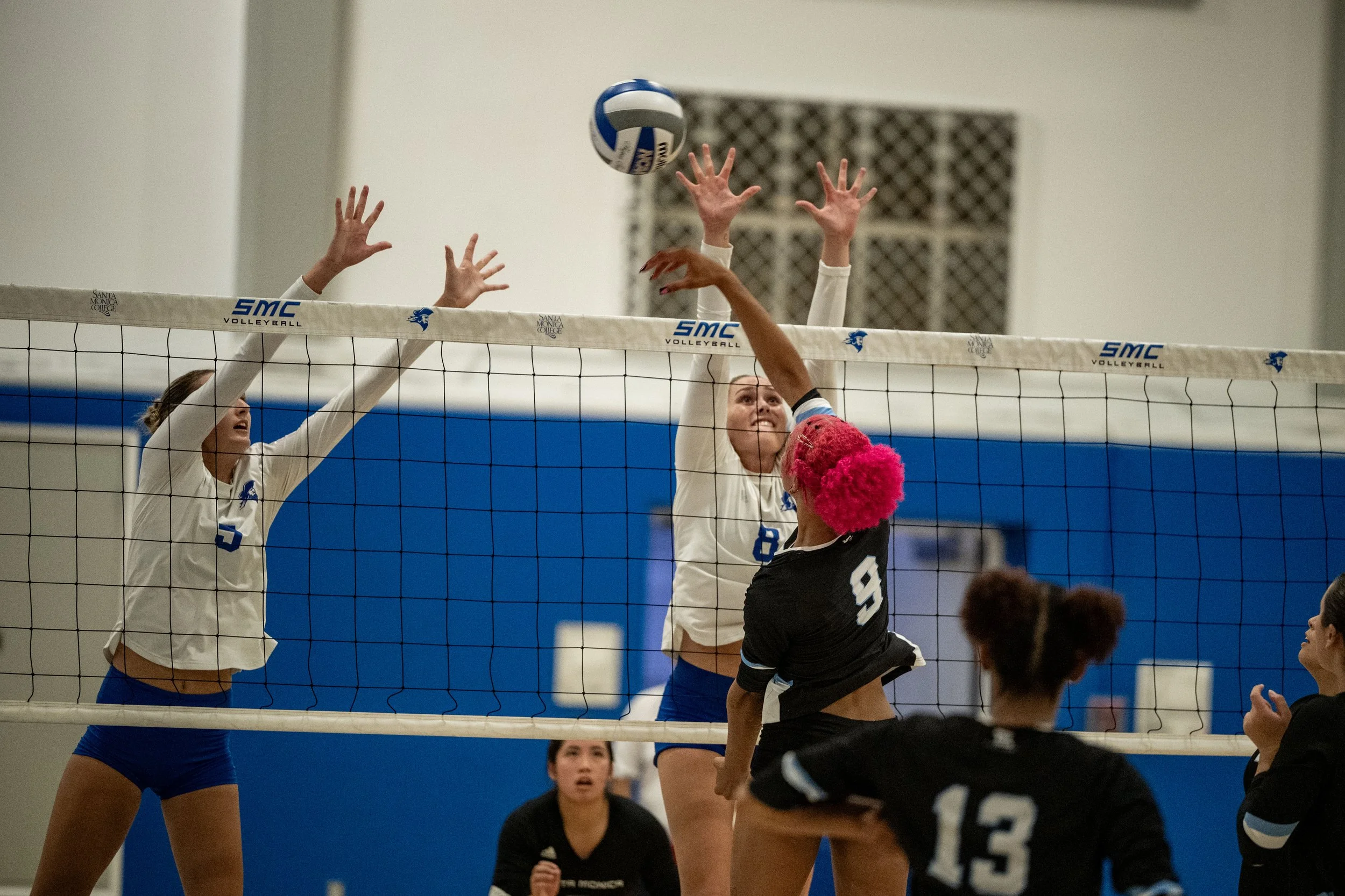 Santa Monica College (SMC) Corsairs’ (L to R) middle blocker (5) Nicole Lankton and outside hitter (8) Reese Luke blocking the shot by Moorpark Raider middle blocker (9) Genessa Johnson on Friday, September 19, 2025, Santa Monica,Calif. The Corsairs
