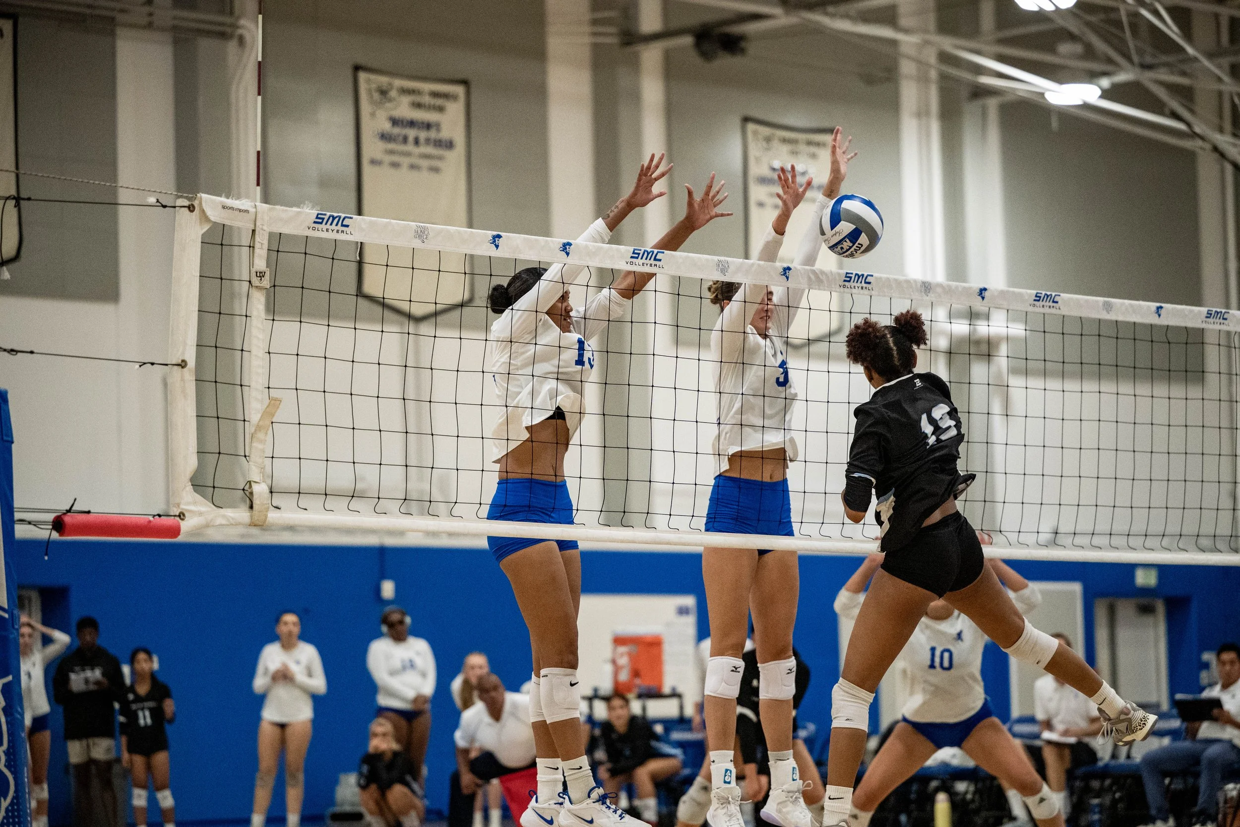 Santa Monica College (SMC) Corsairs (L to R) outside hitter (13) Nadene Taase and middle blocker (3) Amelia Bechtel blocking Moorpark Raider, outside hitter (15) Natsune Makino shot on Friday, September 19, 2025, Santa Monica,Calif. The Corsairs won