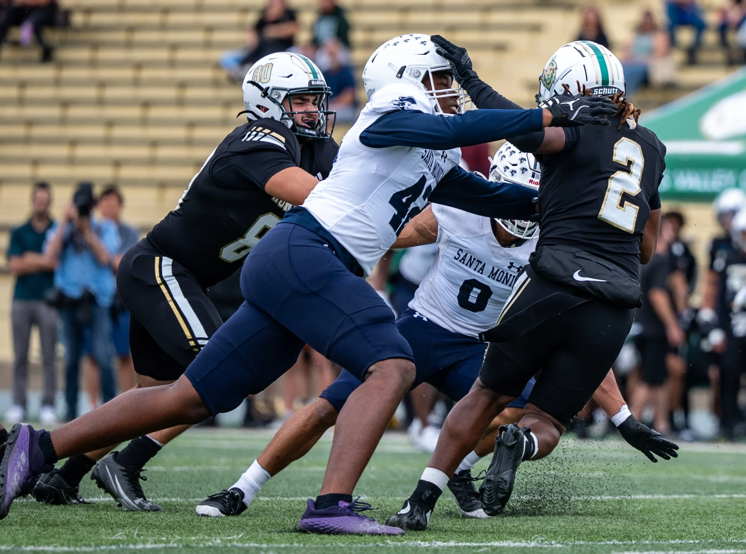 Santa Monica College (SMC) Corsairs’ (L to R) LB (42) Tyler Handfordand LB (0) Sherif Djato tackle Valley College Monarch RB (2) K'Shaun White in the backfield on Saturday, September 20, 2025, Valley Glenn,Calif. The Corsairs won 34-14. (Tom Rosholt