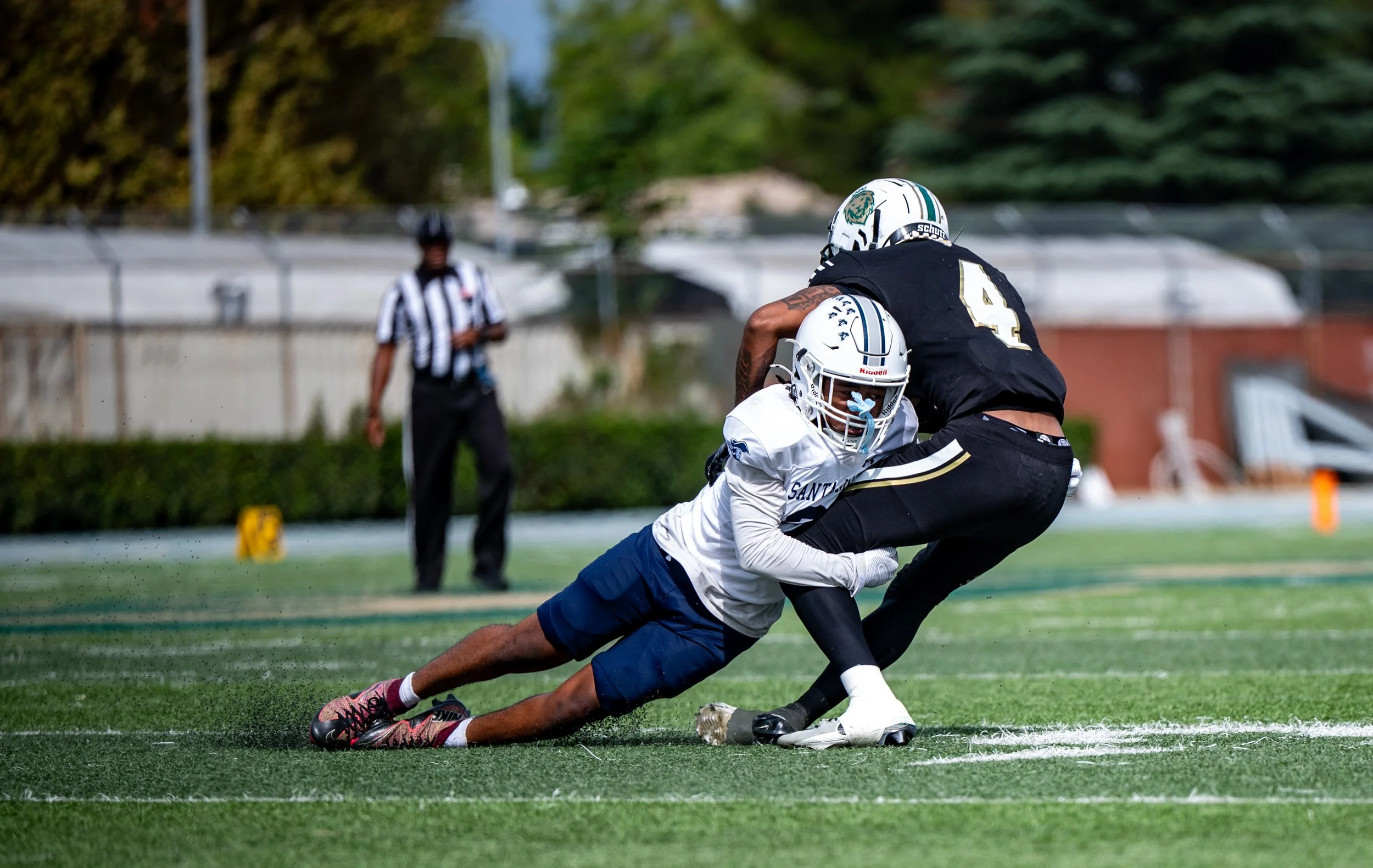 Santa Monica College (SMC) Corsair DB (21) tackling Valley College Monarch WR (4) Joshua Hephzibah-Evans on Saturday, September 20, 2025, Valley Glenn,Calif. The Corsairs won 34-14. (Tom Rosholt | The Corsair)