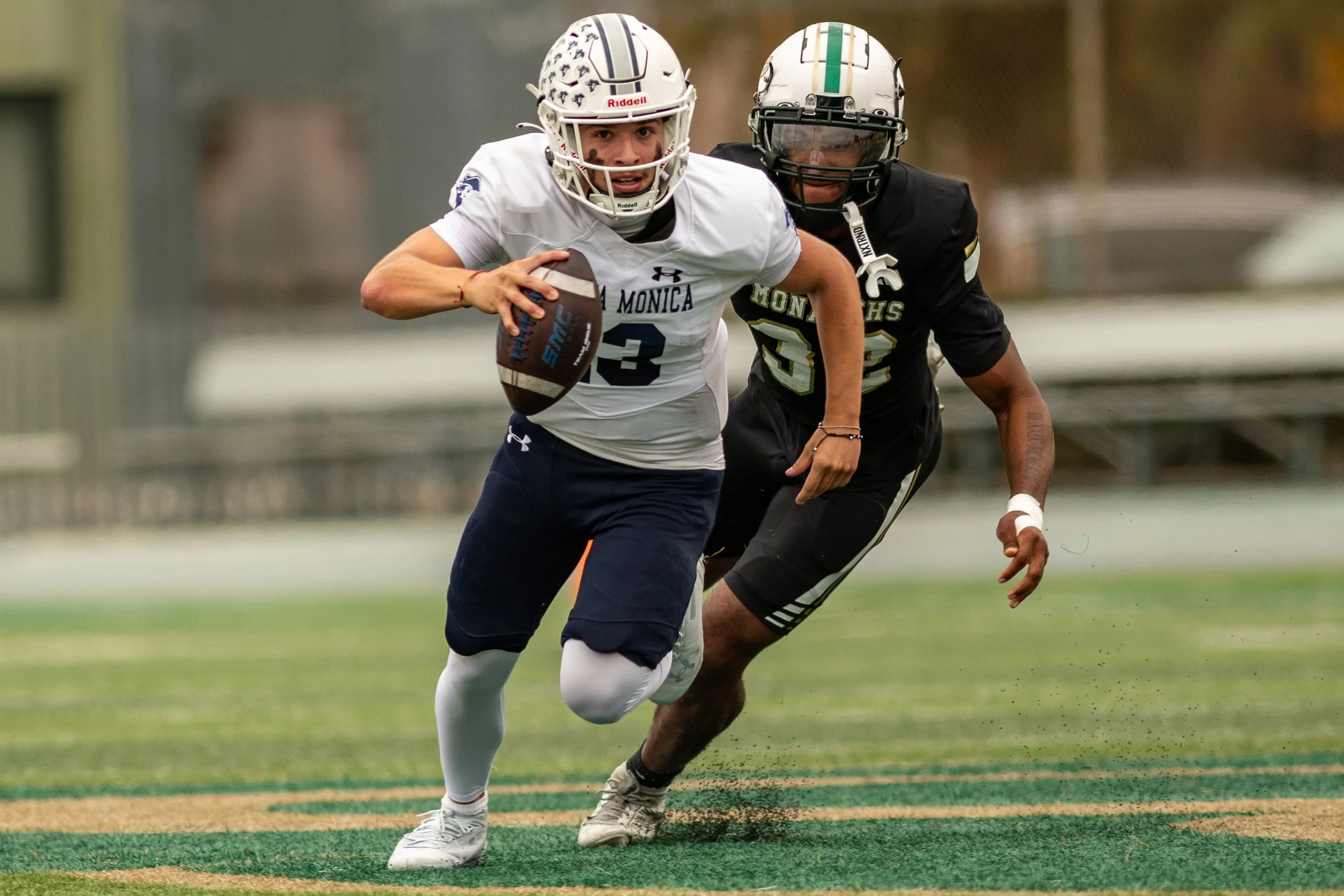 Santa Monica College (SMC) Corsair QB (13) Dylan Moreno scrambling to avoid sack by Valley College Monarch LB (32) Khoury Davis on Saturday, September 20, 2025, Valley Glenn,Calif. The Corsairs won 34-14. (Tom Rosholt | The Corsair)