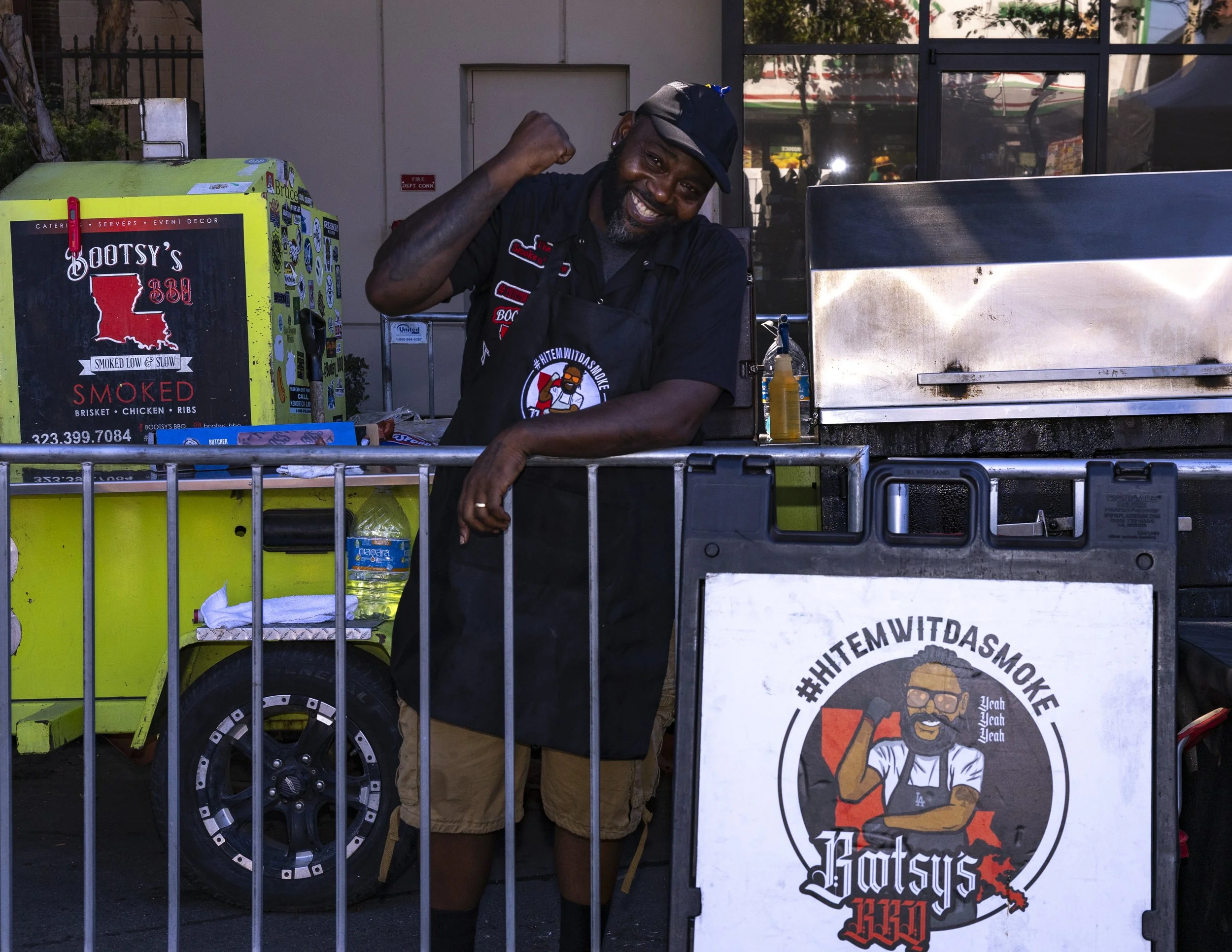 A Bootsy’s BBQ employee posed for a photo in South Los Angeles, Calif., on Saturday, Sept. 20, 2025, during the Central Avenue Jazz Festival. (Kayjel J. Mairena | The Corsair)