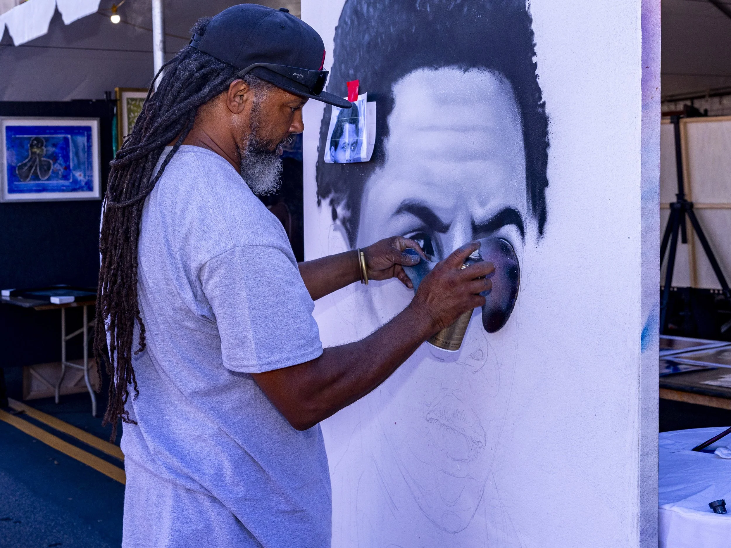 Enkone Goodlow spray-painted a portrait at the 2025 Central Avenue Jazz Festival in South Los Angeles, Calif., on Saturday, Sept. 20, 2025, to showcase his skills. (Kayjel J. Mairena | The Corsair)