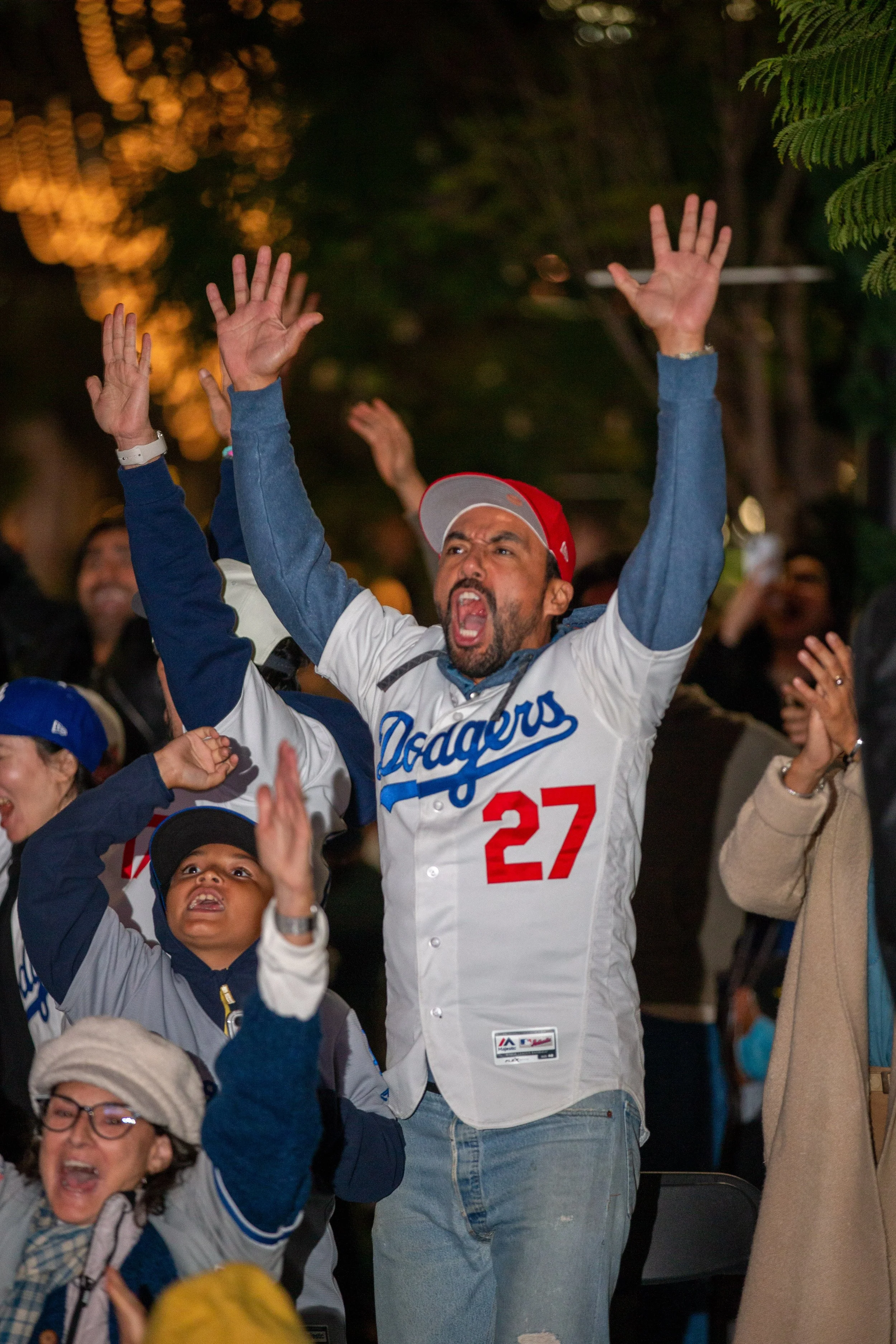 Los Angeles (LA) Dodgers Fans celebrating after LA Dodgers catcher Will Smith hits a solo home run in the top of the 11th inning and becoming the winning run against the Toronto Blue Jays on Saturday, Nov 1st, 2025, as fans watch on 3rd Street Prome