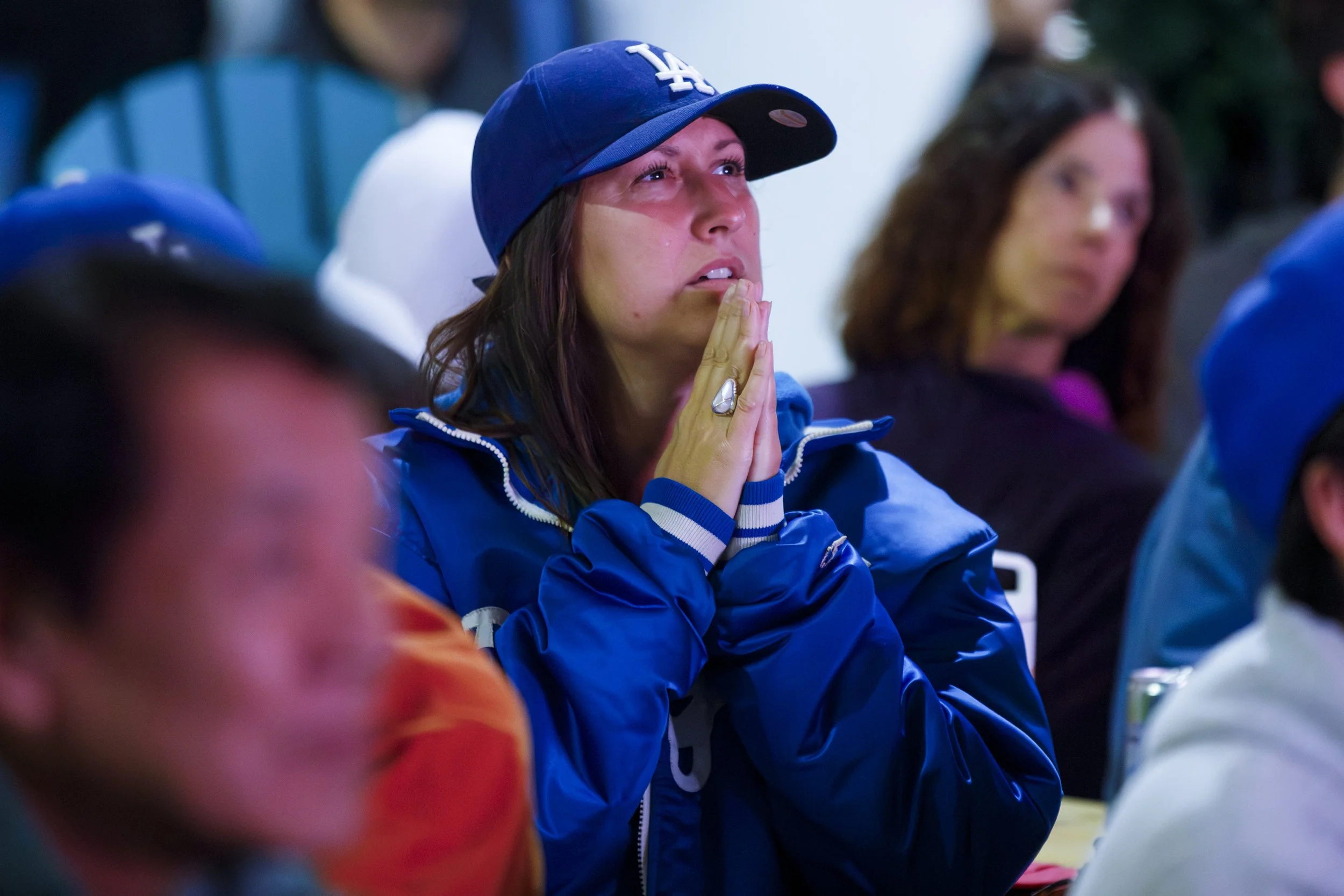  Life long Dodger fan Stefanie Feldman prays for a mirsacle in the 8th inning of 2025 World Series Dodgers down 2-4 as Blue Jays hold the lead at Game 7 of the 2025 World Series watch party at the 3rd St Promenade in Santa Monica, Calif., Saturday No