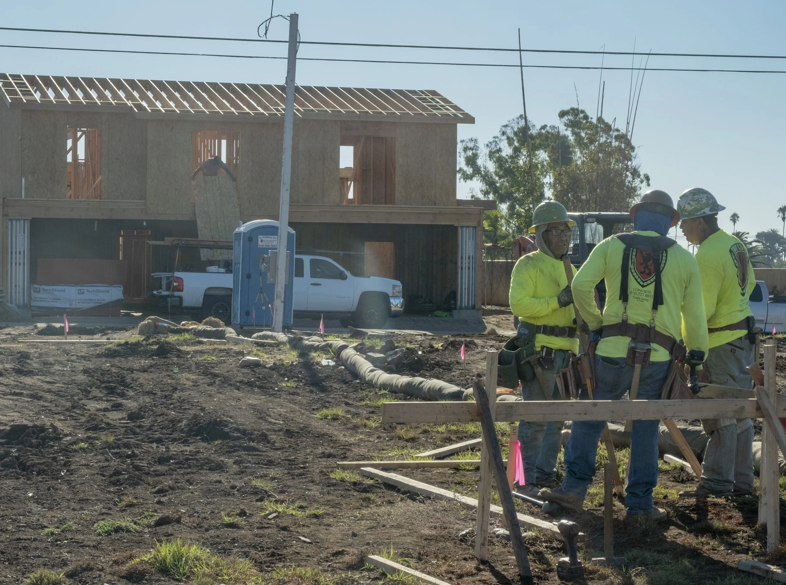  Workers gathered at the construction site on rebuilding a house after the Palisades Fire in Pacific Palisades neighborhood of Los Angeles, Calif. on Friday, Oct. 17, 2025.  After eight months of debris cleanup, Palisadians are beginning to rebuild. 