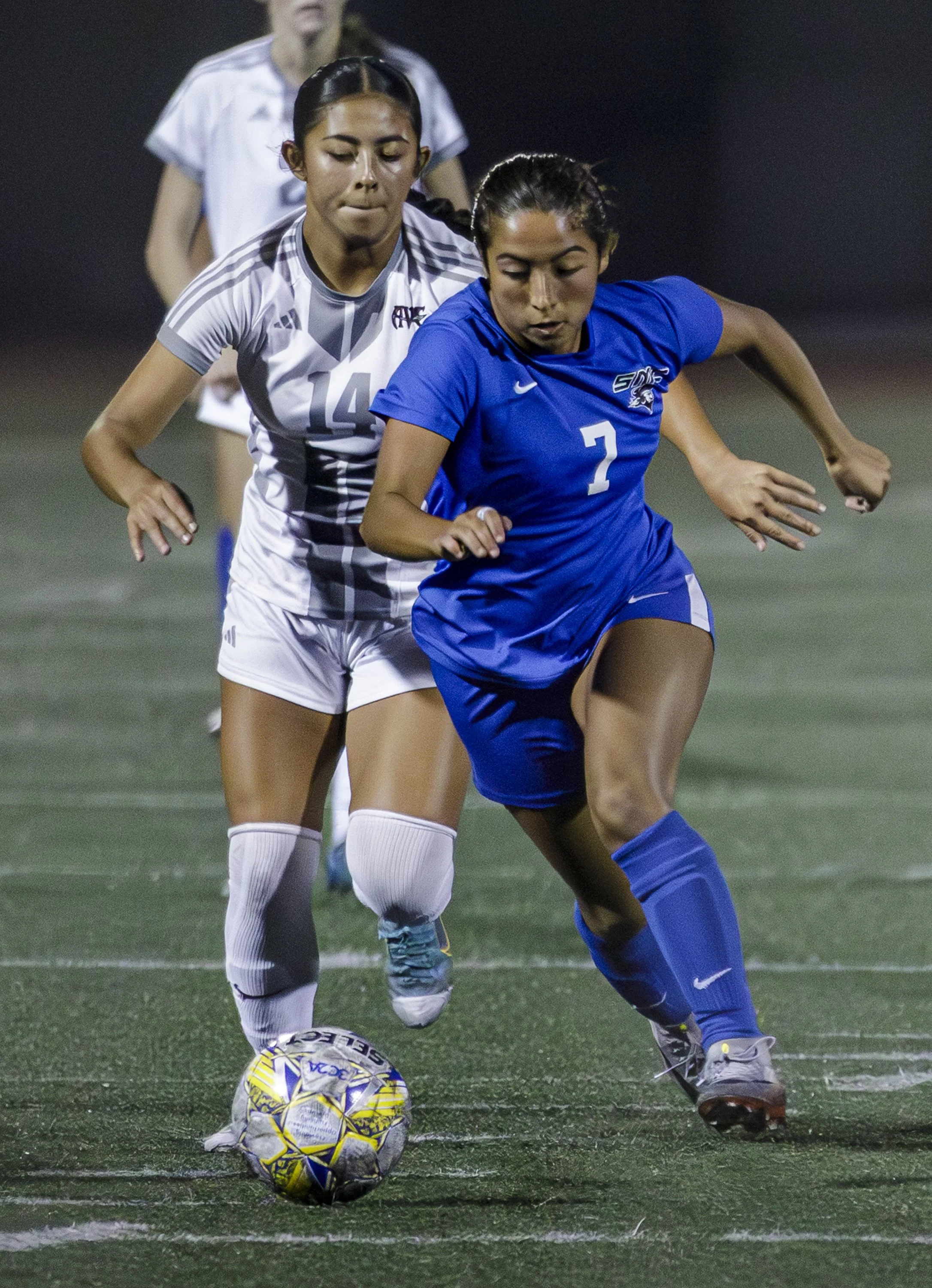  (L-R) Dyleane Silva #14 of the AVC Marauders, Lyric Gomez-Muniz #7 of the SMC Corairs Gomez-Muniz #7 Drives the ball towards goal as the defender Silva #14 tries to steal in the final regular season game against Antelope Valley College Marauders at 