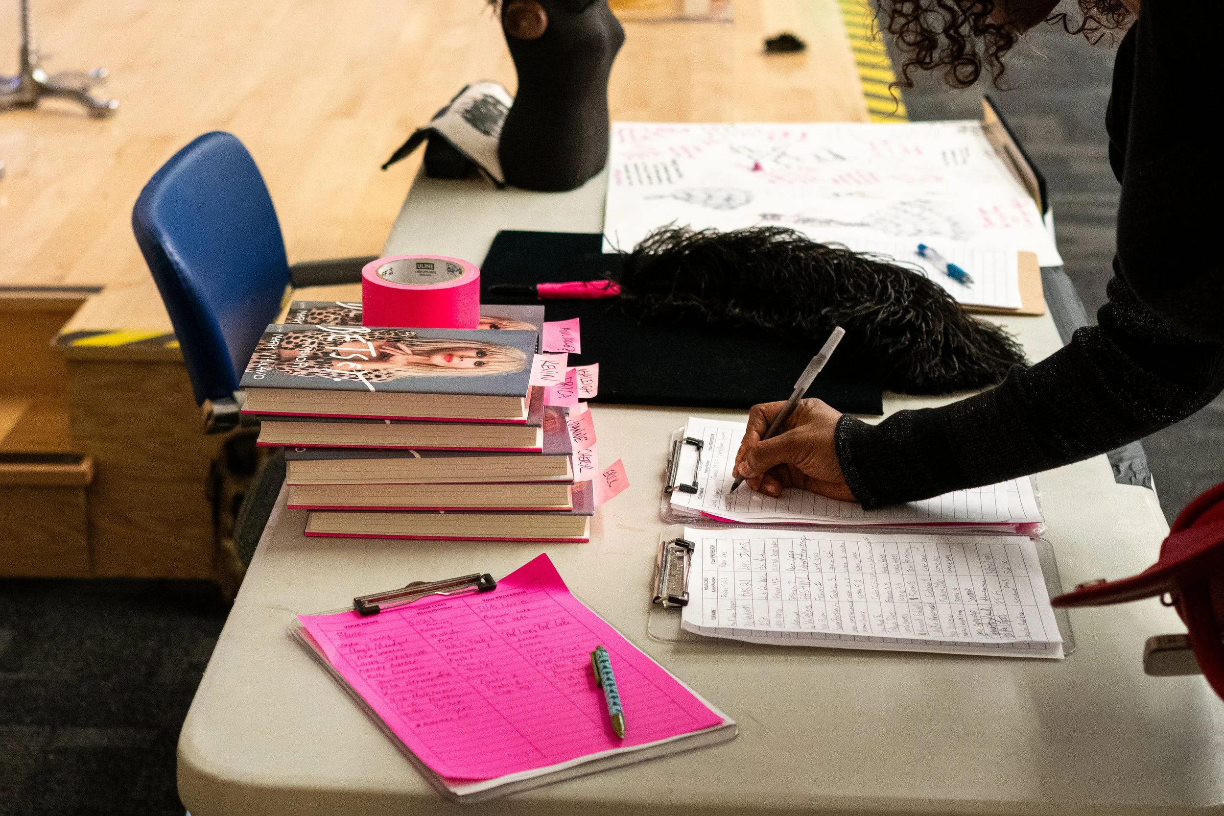  Students write their names down on a sign-in sheet in the Student Services Center shortly before a talk featuring fashion designer Betsey Johnson, hosted by Santa Monica College (SMC) Fashion Design professor Lorrie Ivas, begins, Monday, Nov. 17, 20