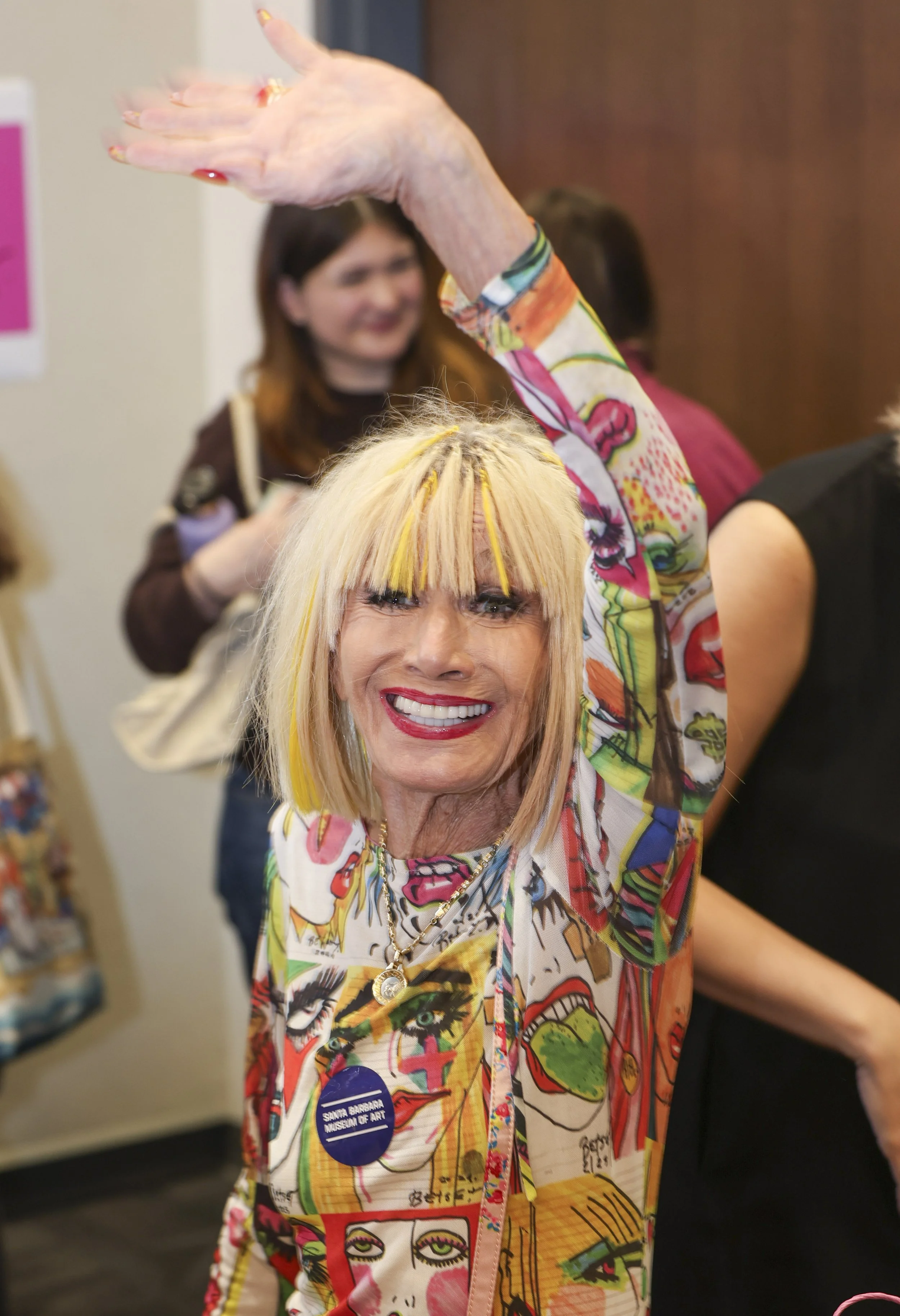  Fashion designer and author Betsey Johnson, 83, of Malibu, waves goodbye after a book signing hosted by the Santa Monica College fashion department in Santa Monica, Calif., on Monday November 17, 2025. Johnson signed copies of her 2020 memoir, “Bets