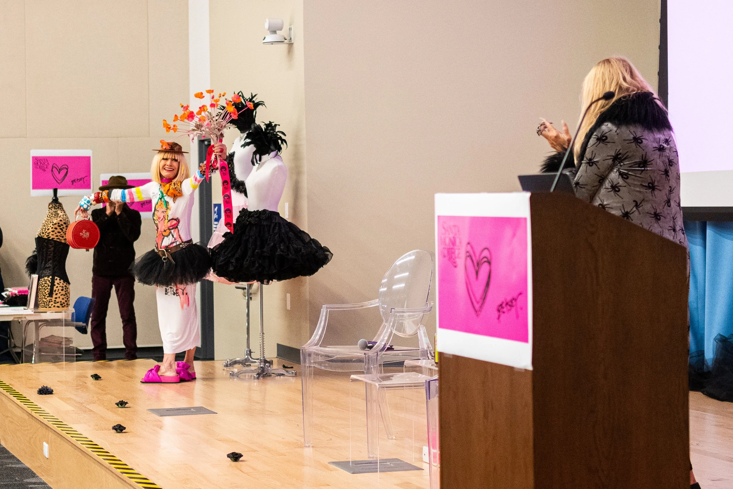  Fashion designer Betsey Johnson enters the auditorium located in the Student Services Center on the Santa Monica College (SMC) campus to give a talk, hosted by SMC Fashion Design professor Lorrie Ivas, Monday, Nov. 17, 2025, in Santa Monica, Calif. 