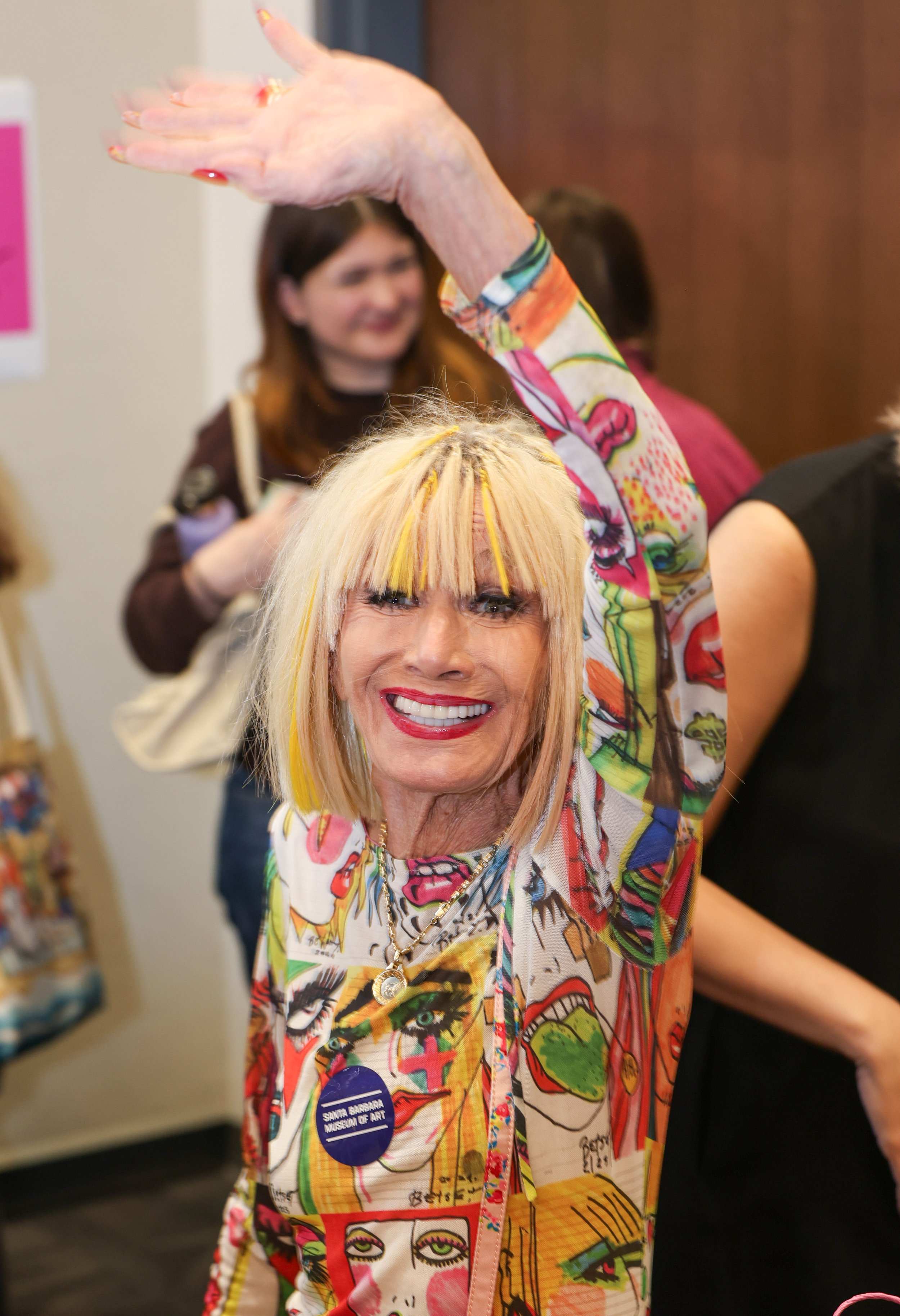  Fashion designer and author Betsey Johnson, 83, of Malibu, waves goodbye after a book signing hosted by the Santa Monica College fashion department in Santa Monica, Calif., on Monday November 17, 2025. Johnson signed copies of her 2020 memoir, “Bets