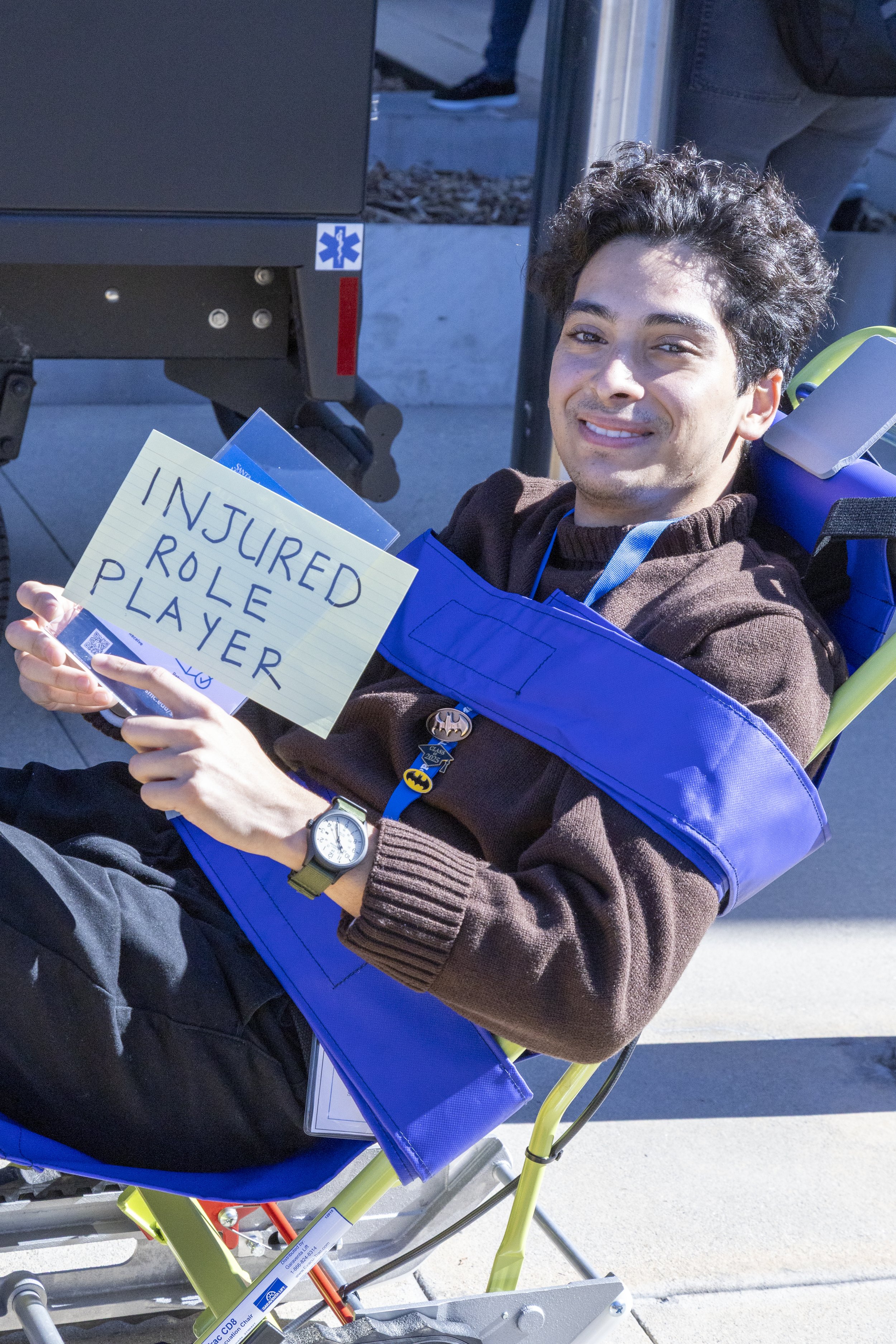  {} waits outside after being "rescued" from the Student Services Center at Santa Monica College (SMC) in Santa Monica, Calif., during the Great Shake-out earthquake drill on Thursday, Oct. 16, 2025. During the drill, some volunteers act out situatio