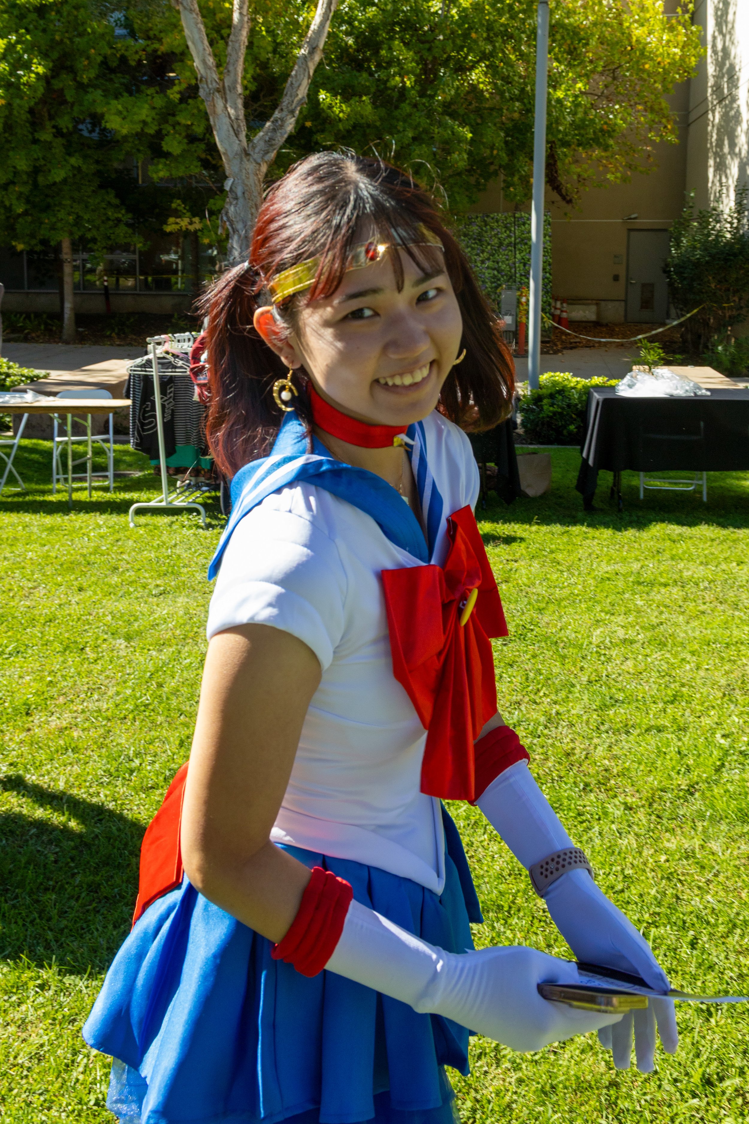  Tamako Sekine (cq), dressed as Sailor Moon from the anime of the same name, poses for the camera at Club Row on the campus of Santa Monica College in Santa Monica, Calif., Thursday, October 30, 2025. Many people showed up in costumes for Halloween t
