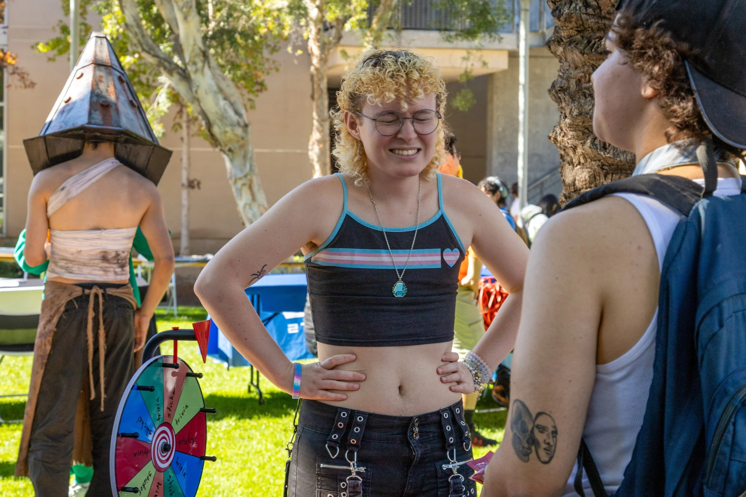  Basil Vautrin (cq) poses for the camera while talking to prospective club members at Club Row on the campus of SMC in Santa Monica, Calif., Thursday, October 30, 2025. Many of SMC's clubs had booths at the event, with free goodies, food, and contest