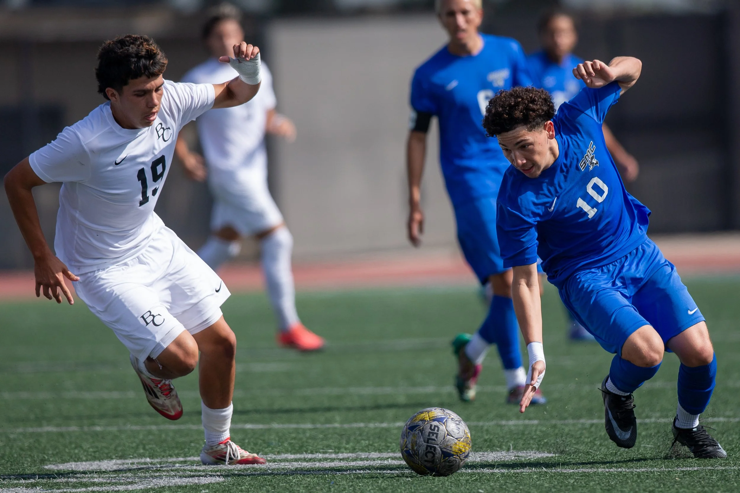  Santa Monica College (SMC) Corsair midfielder Andy Salazar (#10) regains balance and tries to regain control of the ball as Bakersfield College Renegade midfielder Andrew Orozco (#19) attacks to gain possession of the ball at SMC Corsair Stadium, Sa